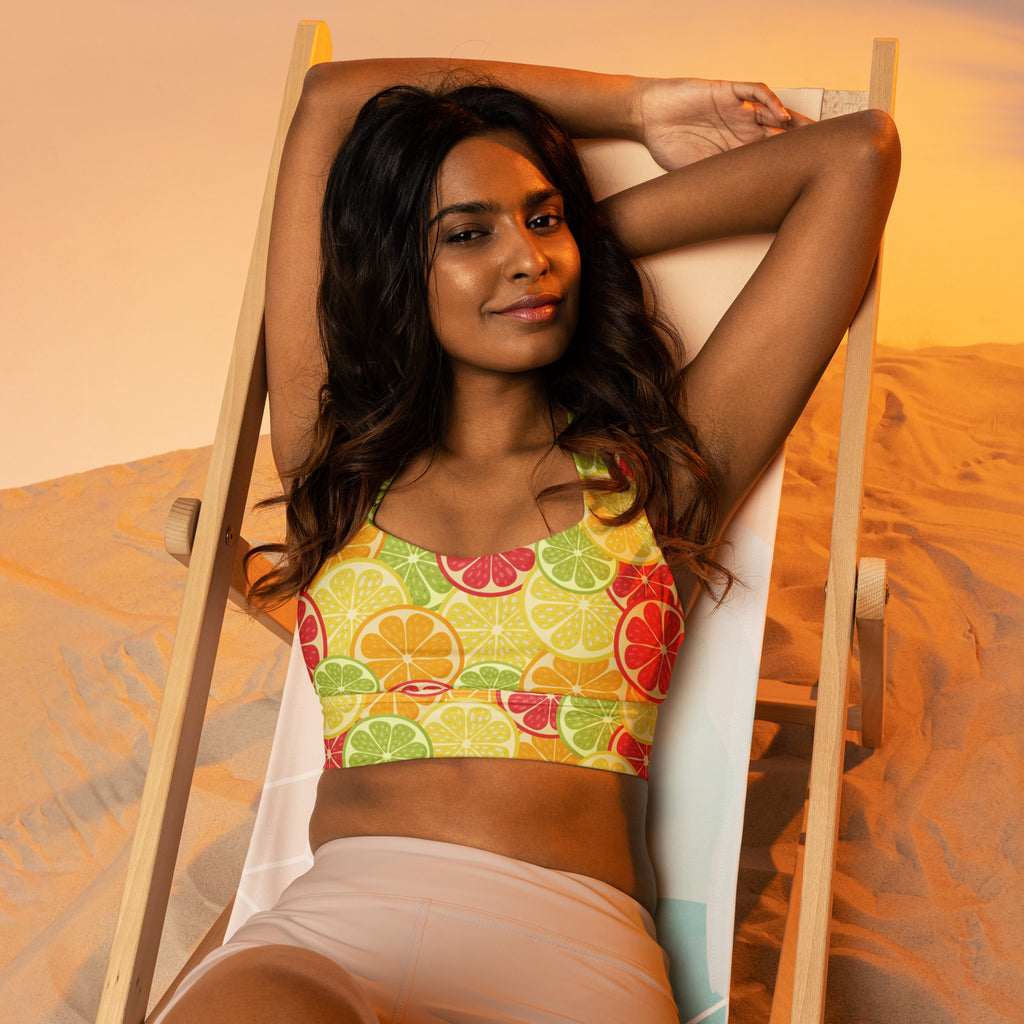 Women’s vibrant yellow buttery soft recycled longline sports bra with citrus slice pattern for high intensity support