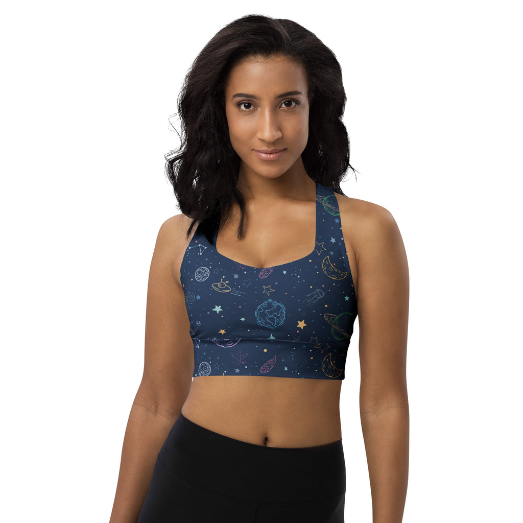 A navy blue recycled longline sports bra with a colorful galaxy design for high intensity support and quick dry