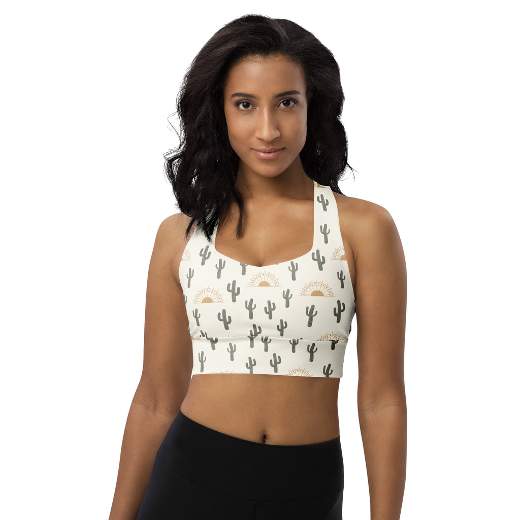White longline sports bra with black cactus and gold sunburst patterns buttery soft recycled fabric high intensity support