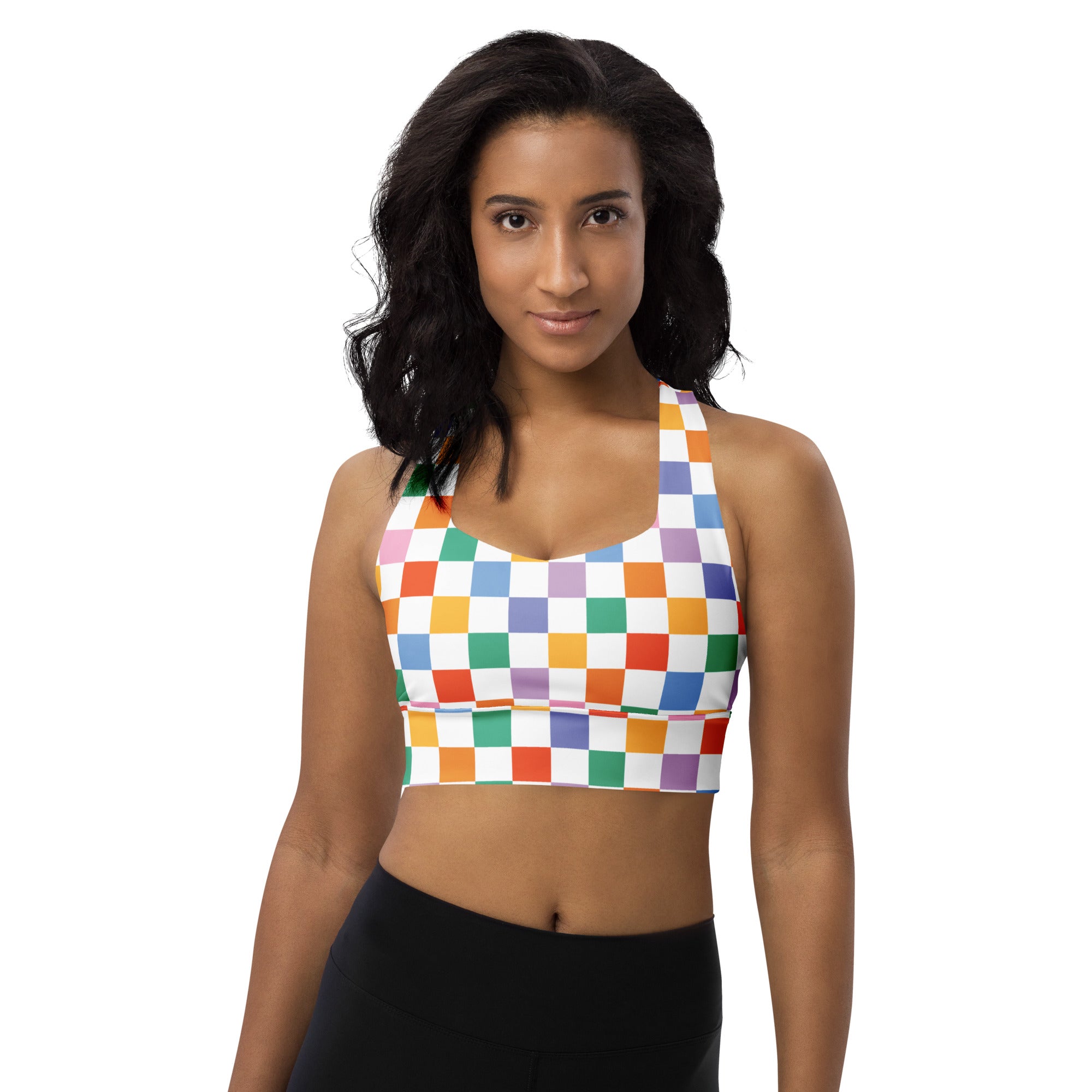 A vibrant rainbow checkered women’s sports bra with halter neckline, buttery soft recycled fabric, high support, and UPF 50+