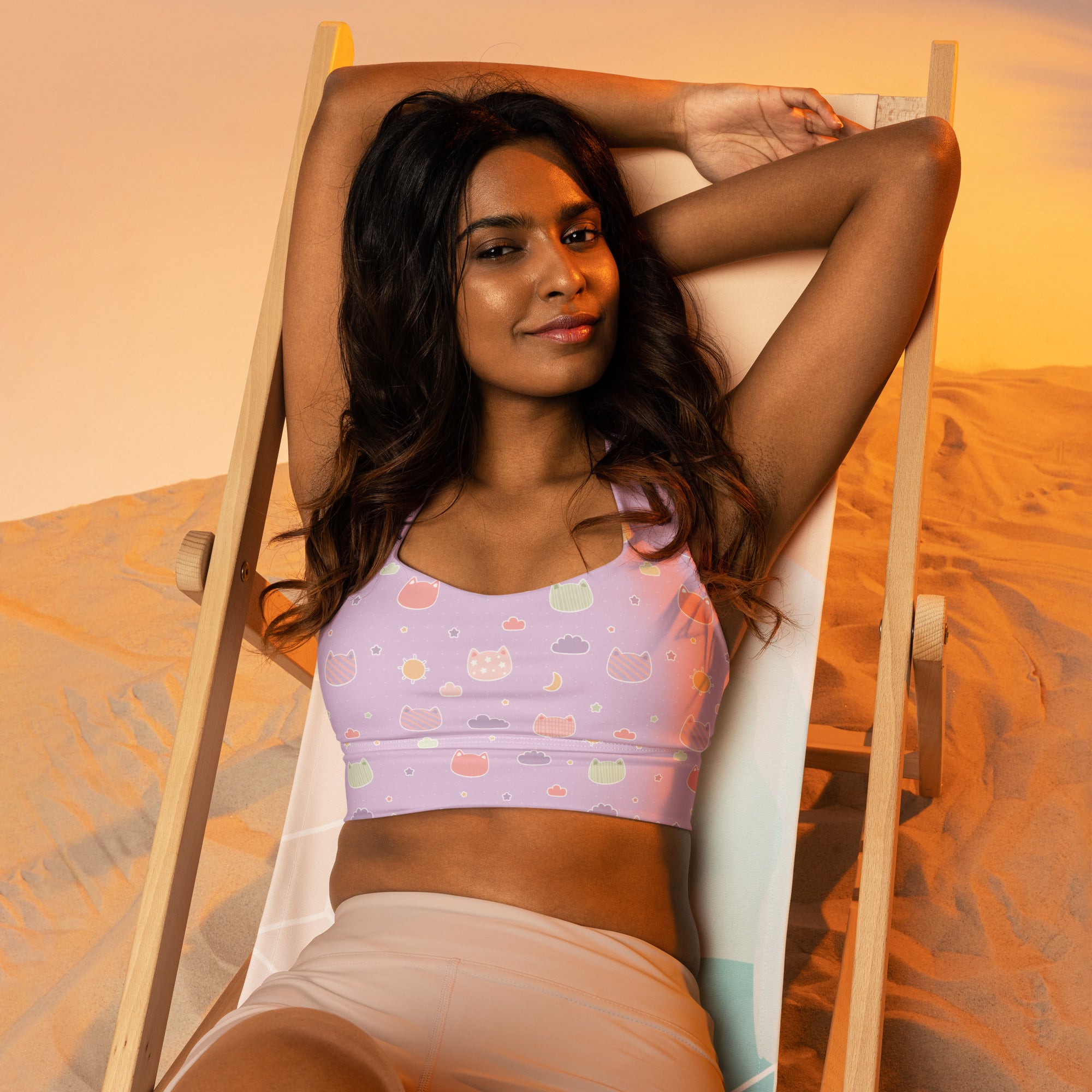 Pastel lavender longline sports bra with playful colorful cartoon cats and clouds pattern high intensity support