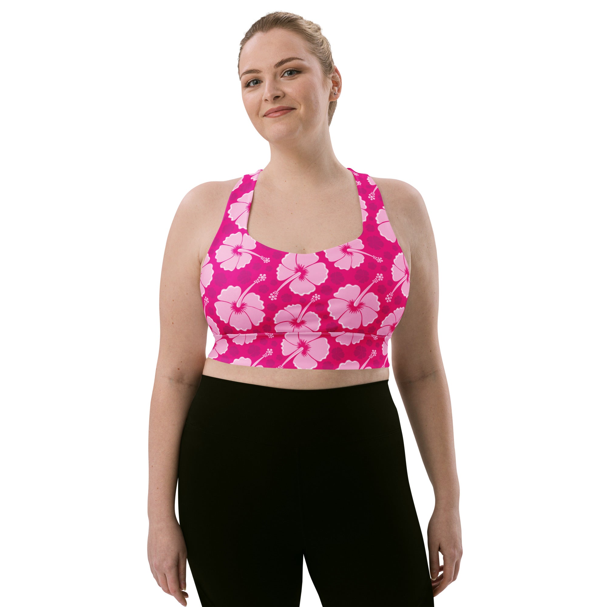 Vibrant pink hibiscus patterned buttery soft recycled longline sports bra with high intensity support and removable padding
