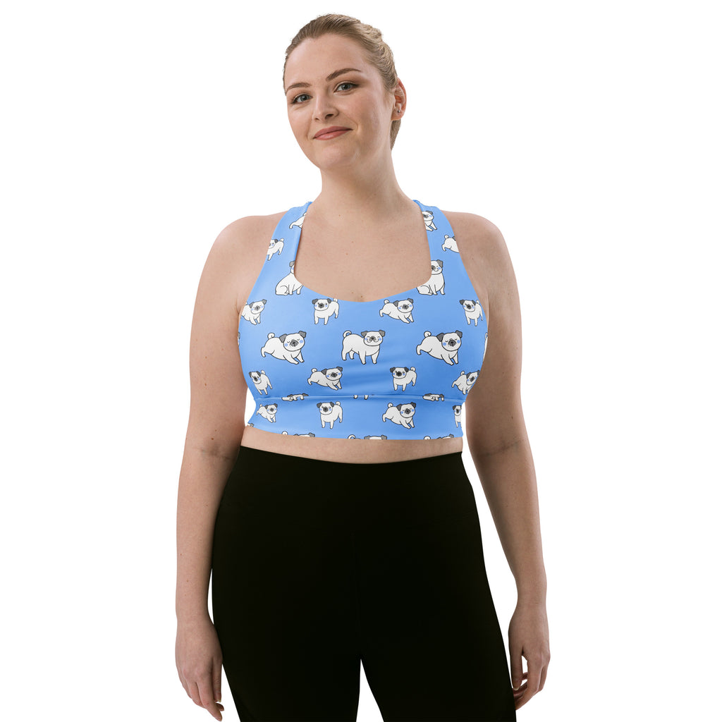 Light blue womens longline sports bra with recycled fabric featuring playful white pug dog pattern and high intensity support