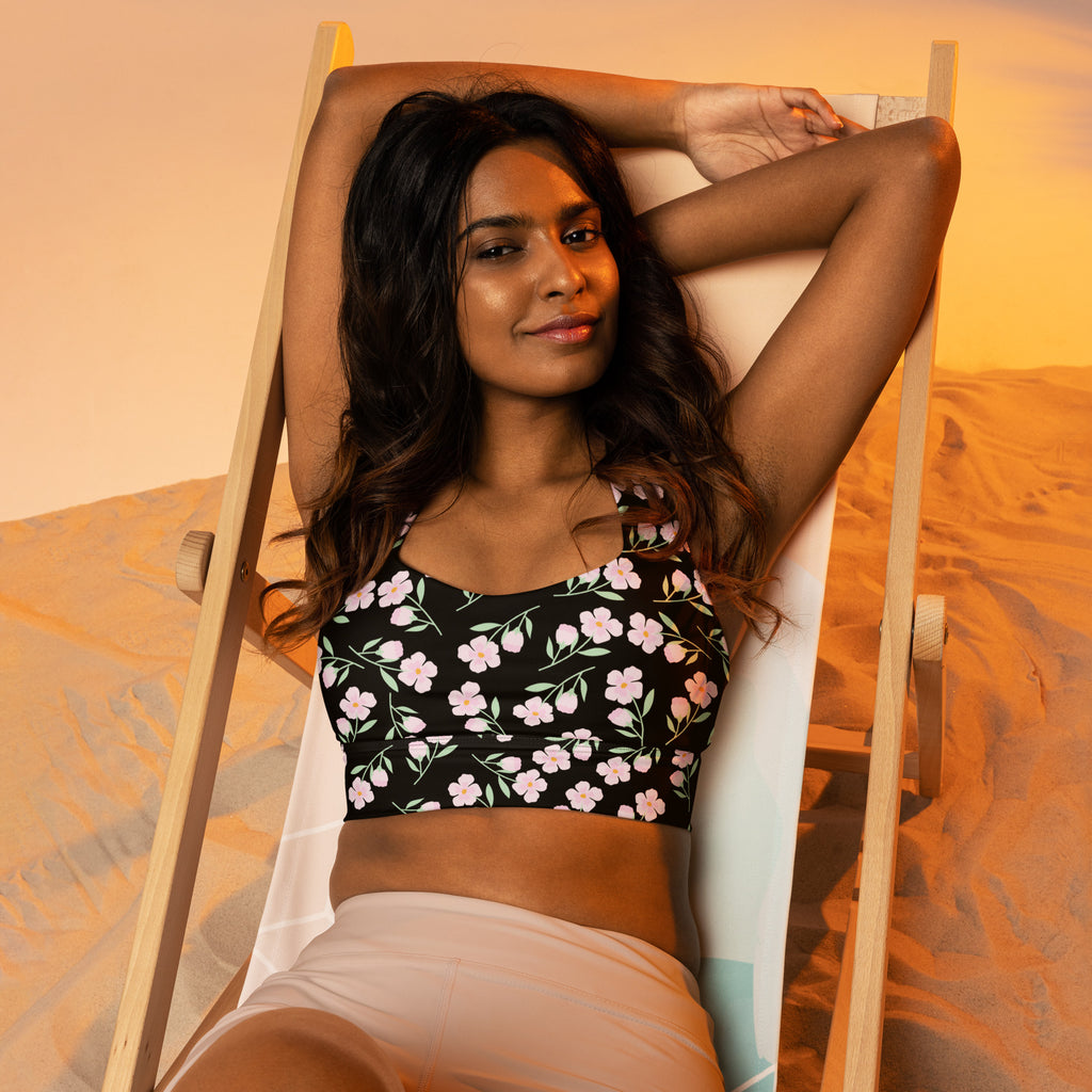 Women’s black floral print buttery soft recycled longline sports bra with pink and white flowers for high intensity support