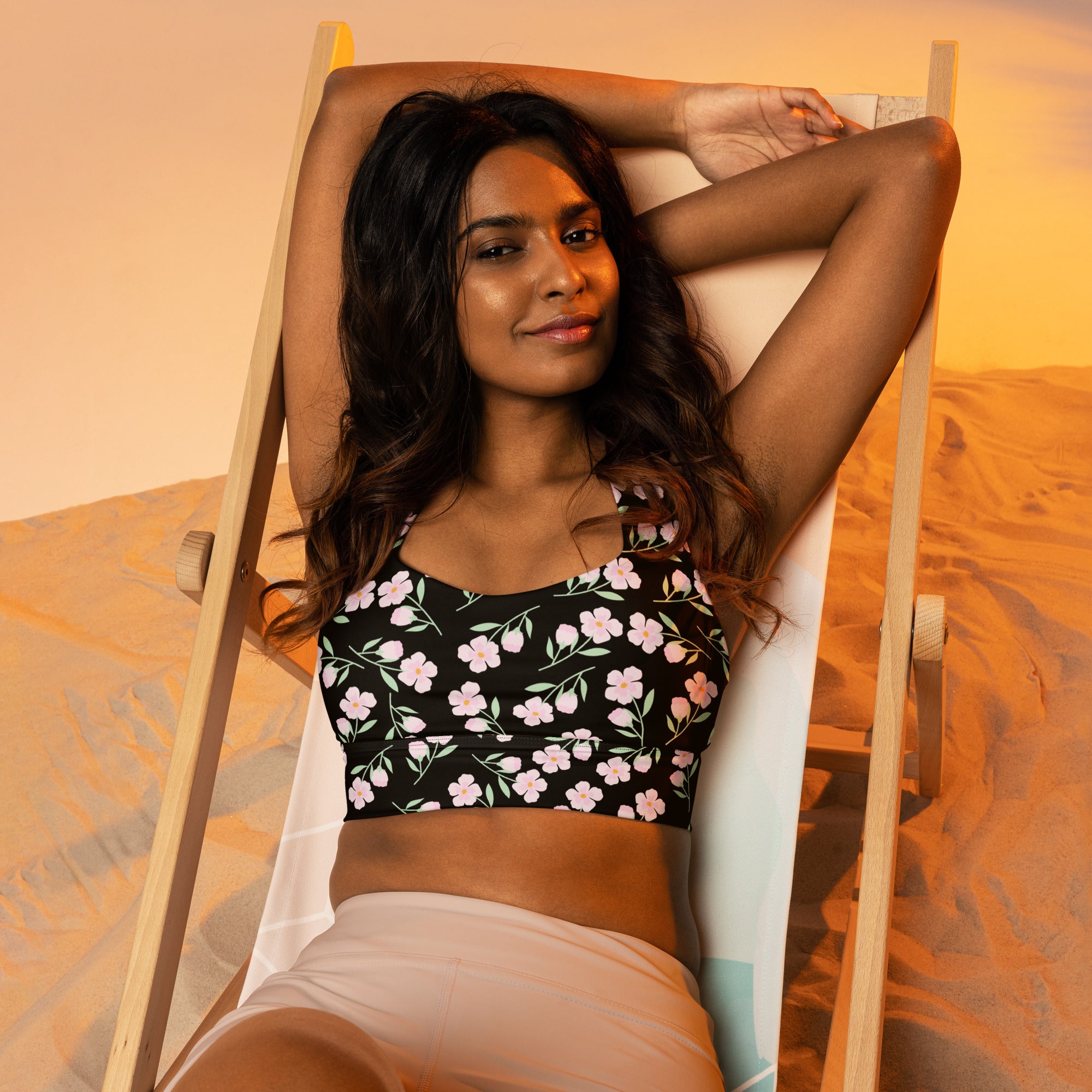 Women’s black floral print buttery soft recycled longline sports bra with pink and white flowers for high intensity support