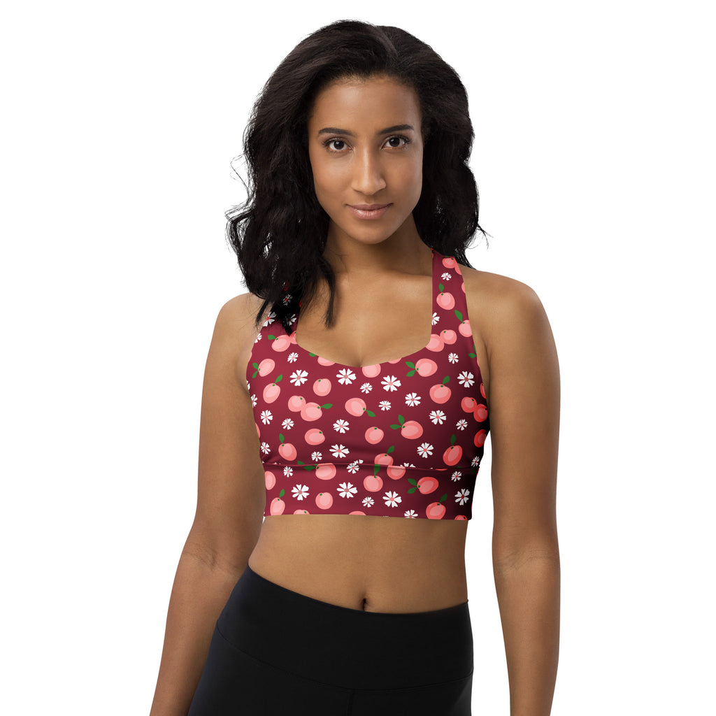 Women’s maroon longline sports bra with pink peach and white daisy pattern high intensity support quick dry fabric