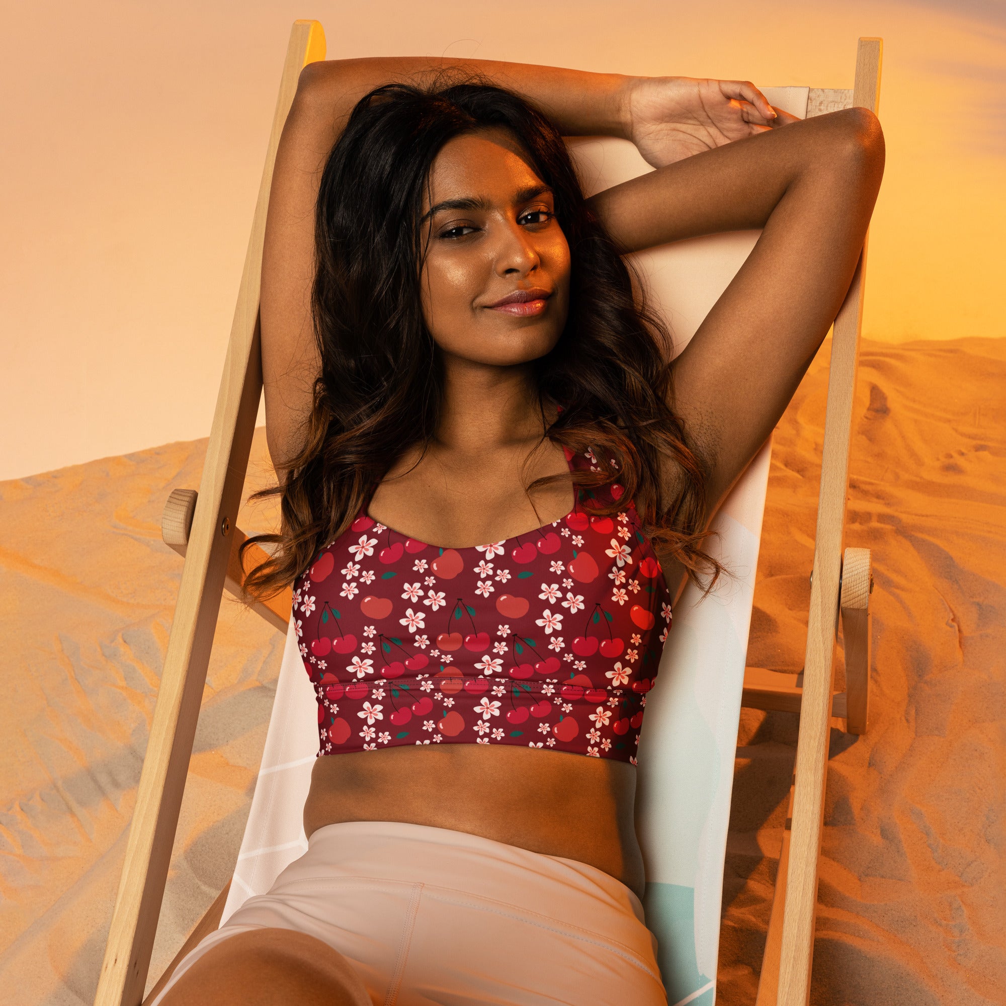 Women’s maroon floral and fruit patterned recycled longline sports bra with high intensity support and quick dry fabric