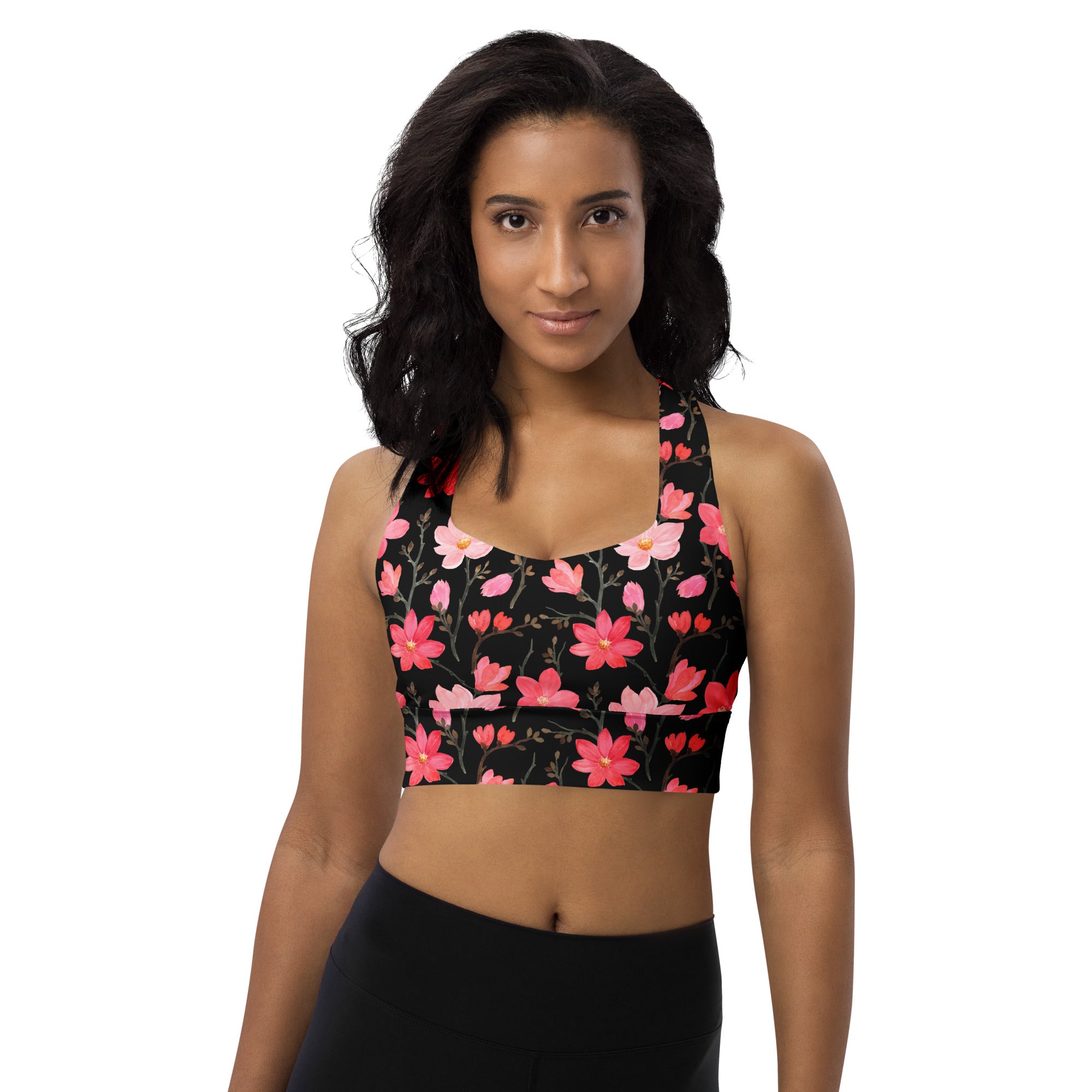 Women’s black sports bra with pink and red floral pattern buttery soft recycled fabric high intensity support