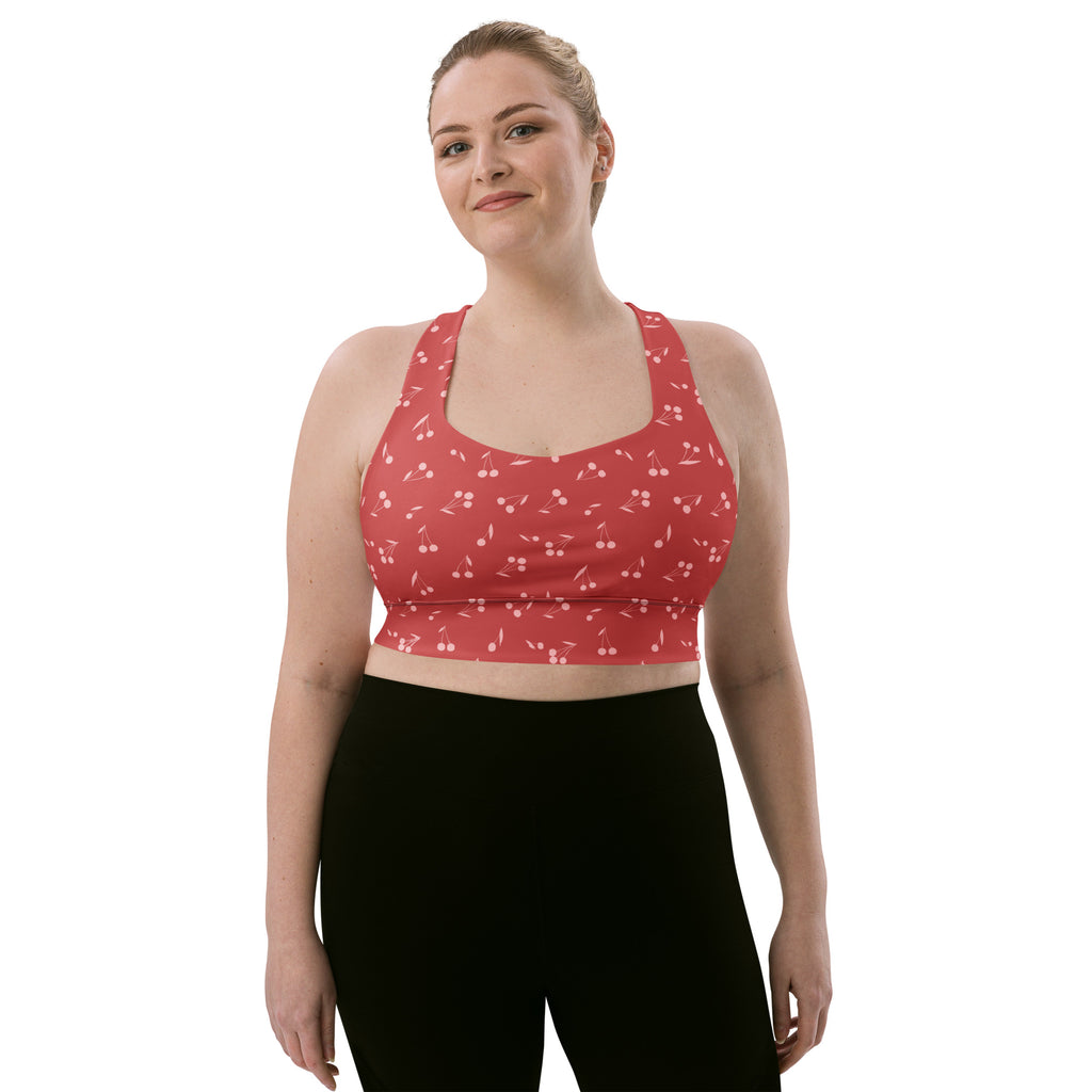Women’s soft red cherry patterned recycled longline sports bra with high intensity support and quick dry fabric