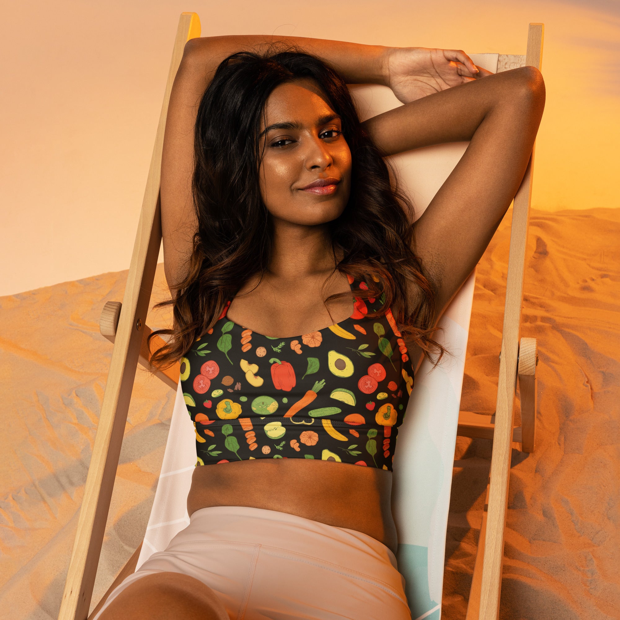 Black buttery soft recycled longline sports bra with vibrant veggie print for high intensity support and quick dry