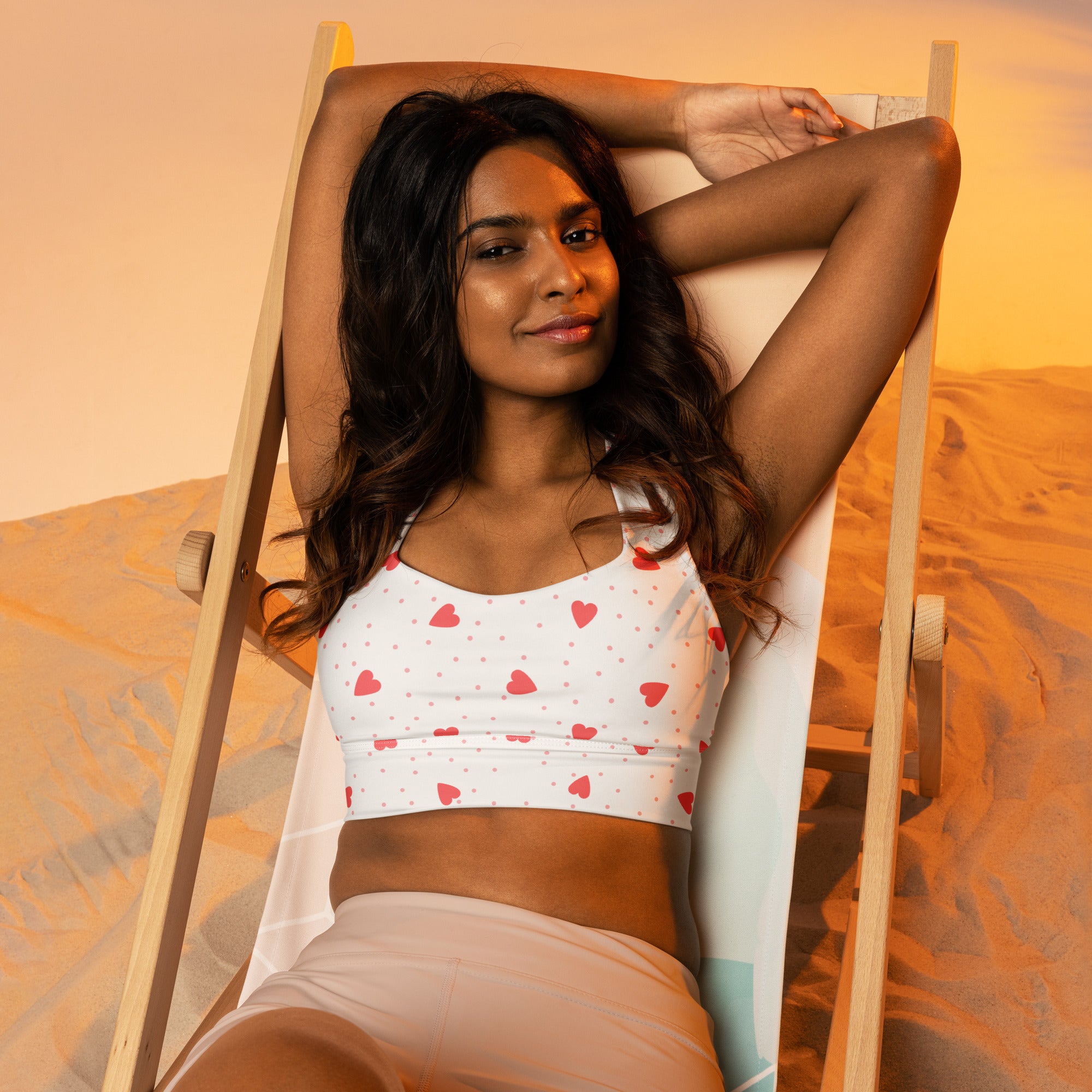 White longline sports bra with red heart and dot pattern buttery soft recycled fabric high intensity support