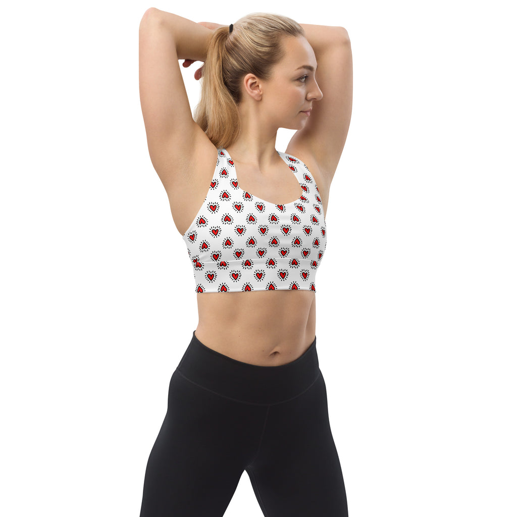 White longline sports bra with red heart patterns buttery soft recycled fabric high intensity support and upf 50+