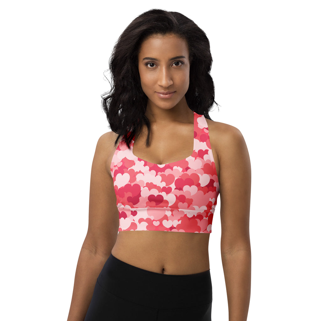 Women’s pink and white heart-patterned buttery soft recycled longline sports bra with halter neckline and high support