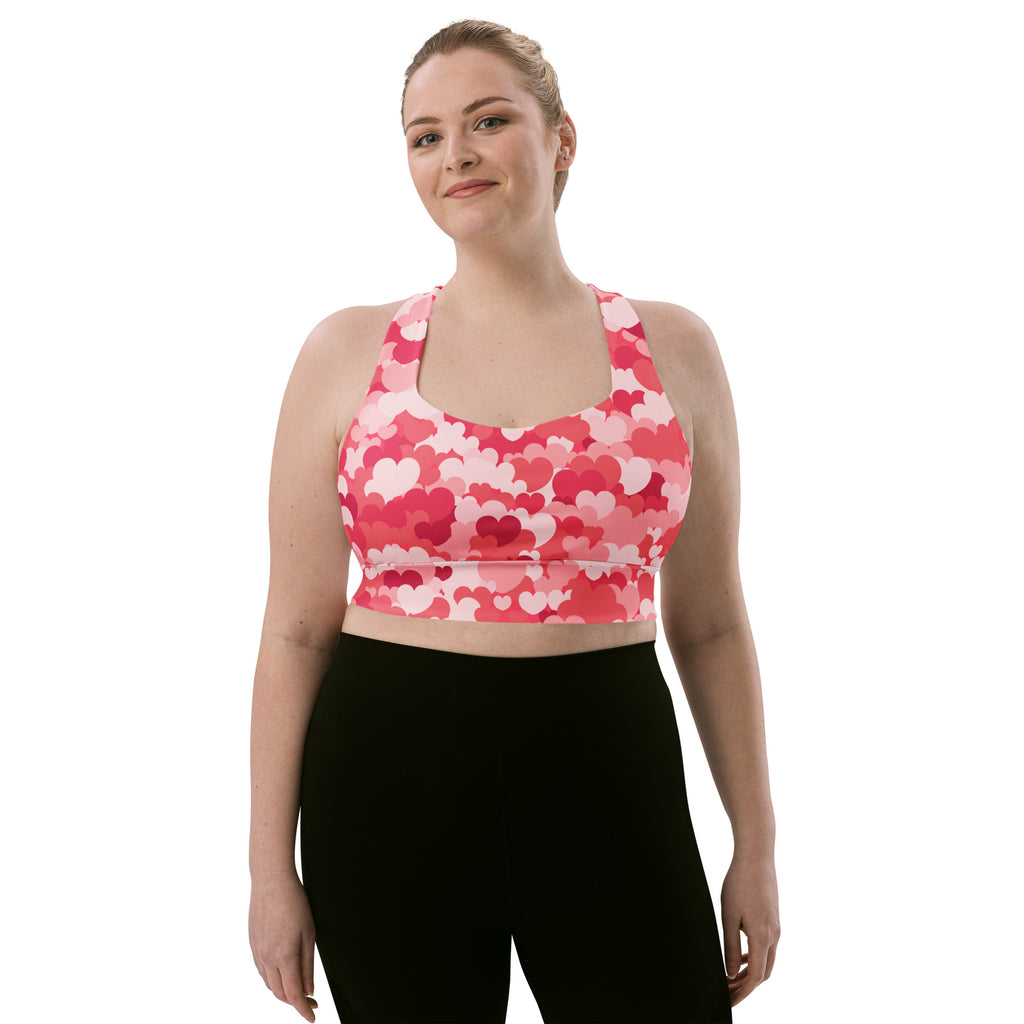 Women’s pink and white heart patterned buttery soft recycled longline sports bra with racerback straps for high intensity support