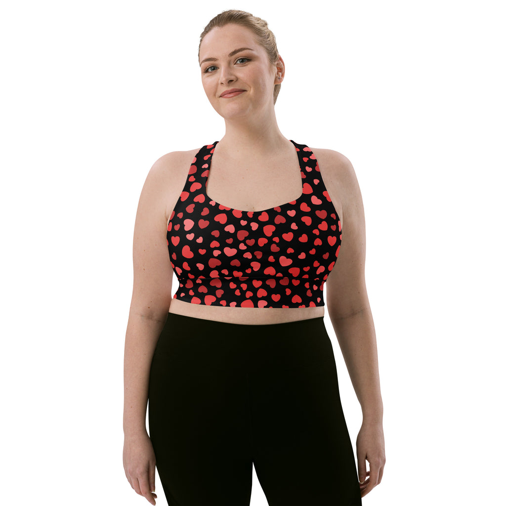 Black buttery soft recycled longline sports bra with red heart pattern designed for high intensity support and quick dry