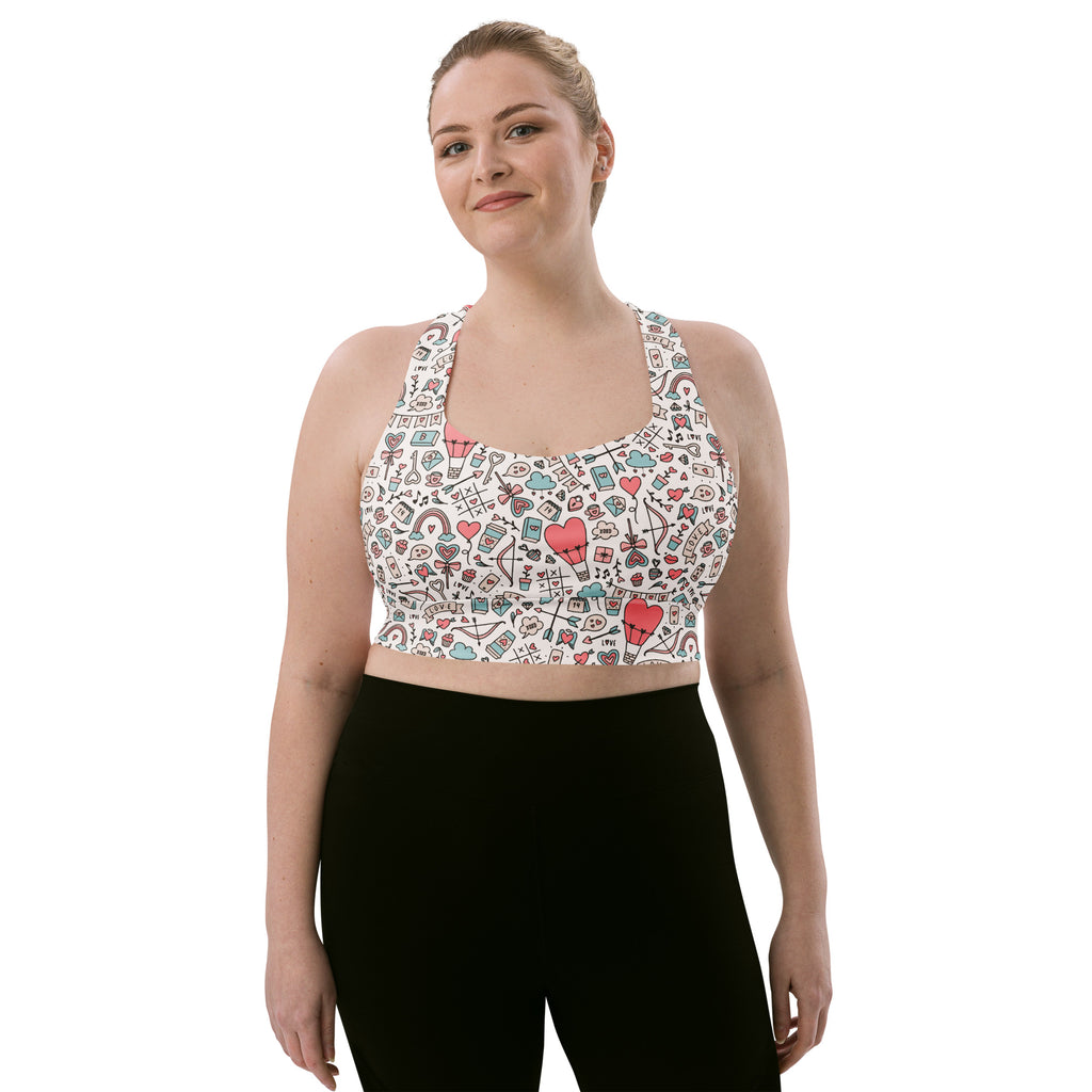 White longline sports bra with colorful doodle hearts and rainbows made from buttery soft recycled fabric for high support