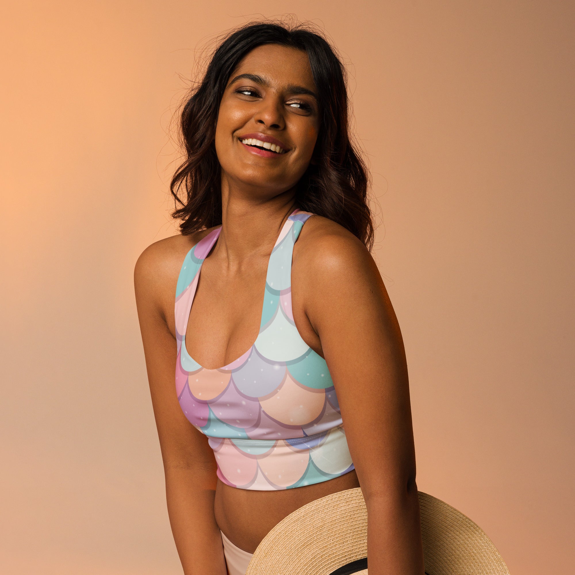 Pastel mermaid-scale patterned longline sports bra with high intensity support quick dry and upf 50 plus protection