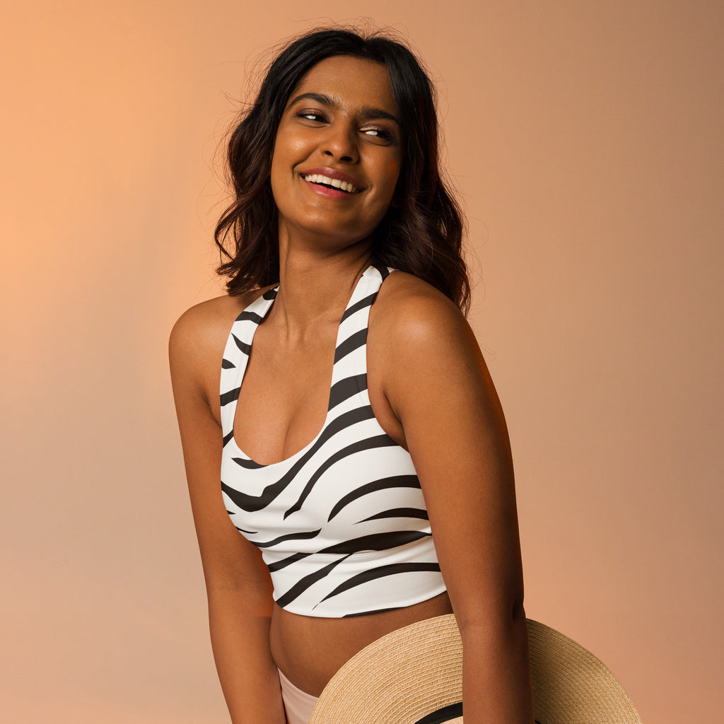 Women’s zebra print halter top with fitted design made of buttery soft recycled fabric for high intensity support