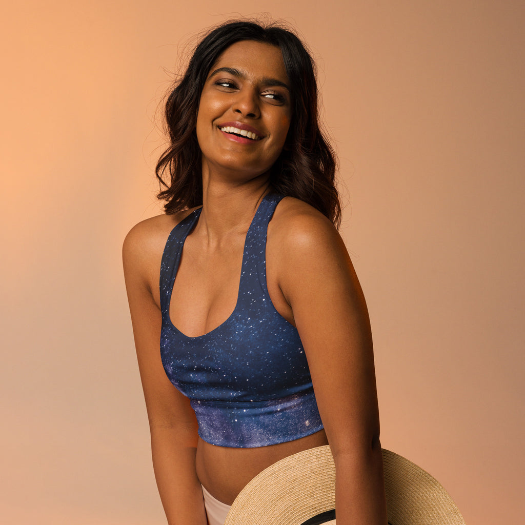 Blue galaxy-print longline sports bra with halter neck made of buttery soft recycled fabric for high intensity support