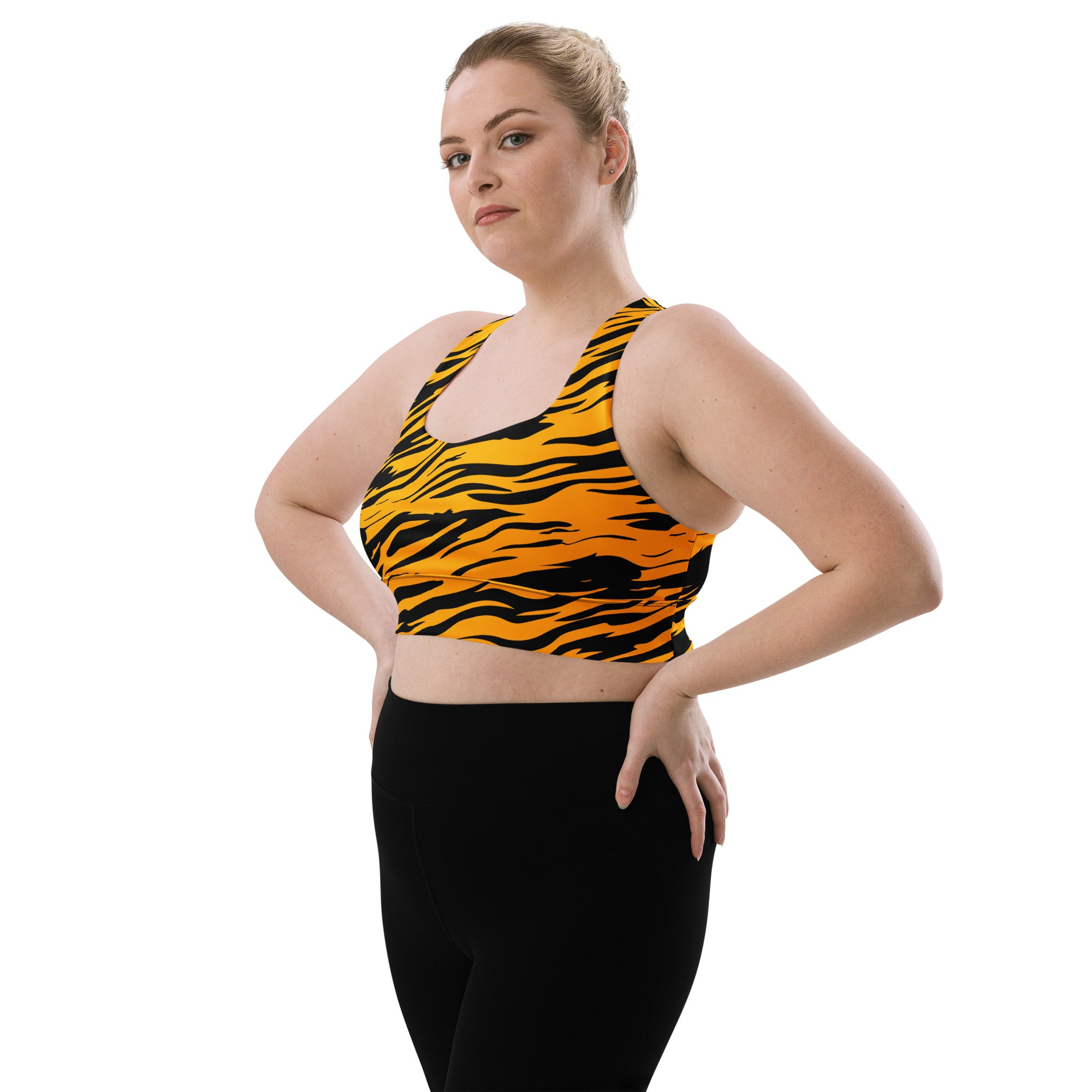 Women’s vibrant orange and black tiger print longline sports bra with racerback design, high intensity support, and quick dry fabric