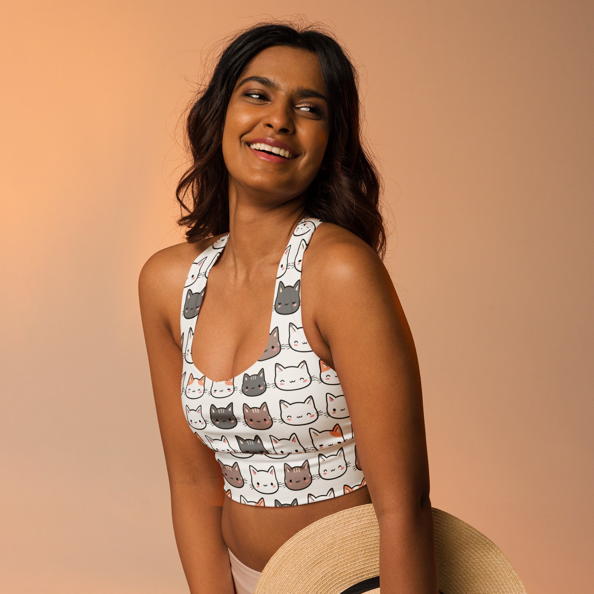 White longline sports bra with cat face pattern in gray white and orange buttery soft recycled fabric for high intensity support