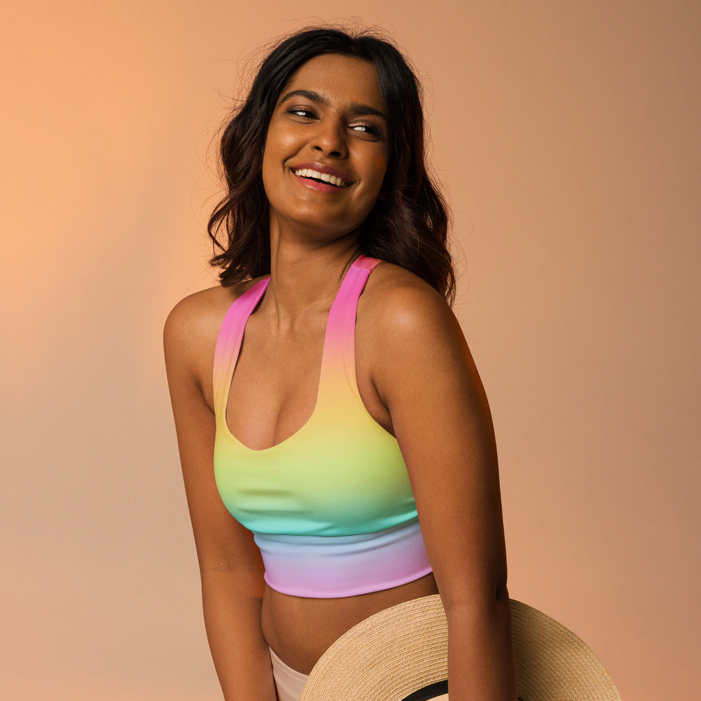 Women’s bright rainbow gradient sports bra made of stretchy fabric offers high intensity support and quick dry features