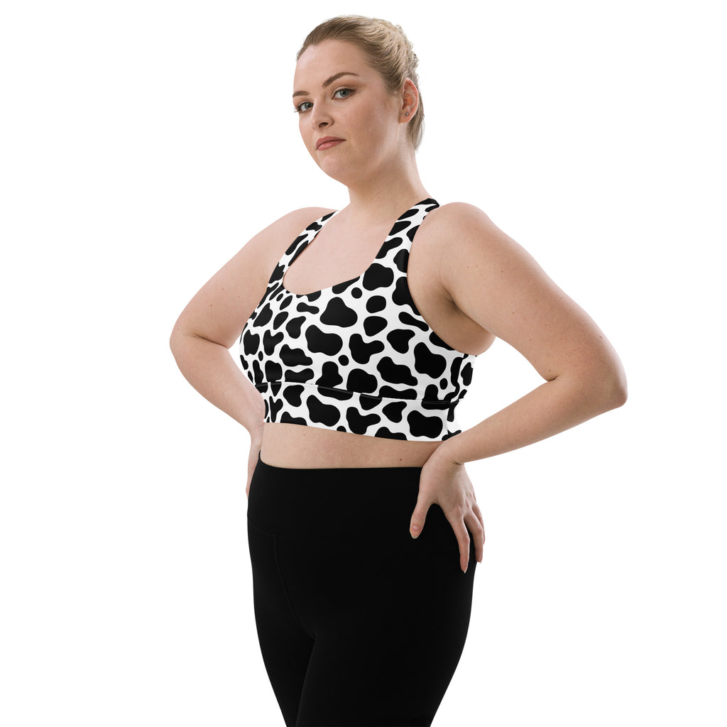 Women’s black and white cow print buttery soft recycled longline sports bra with high intensity support
