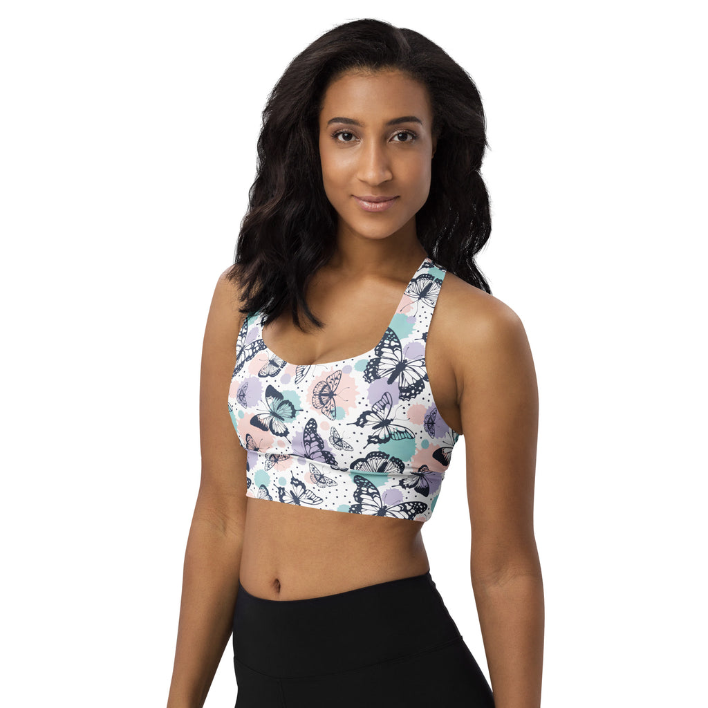 Women’s recycled longline sports bra with vibrant black teal and lavender butterfly pattern high intensity support