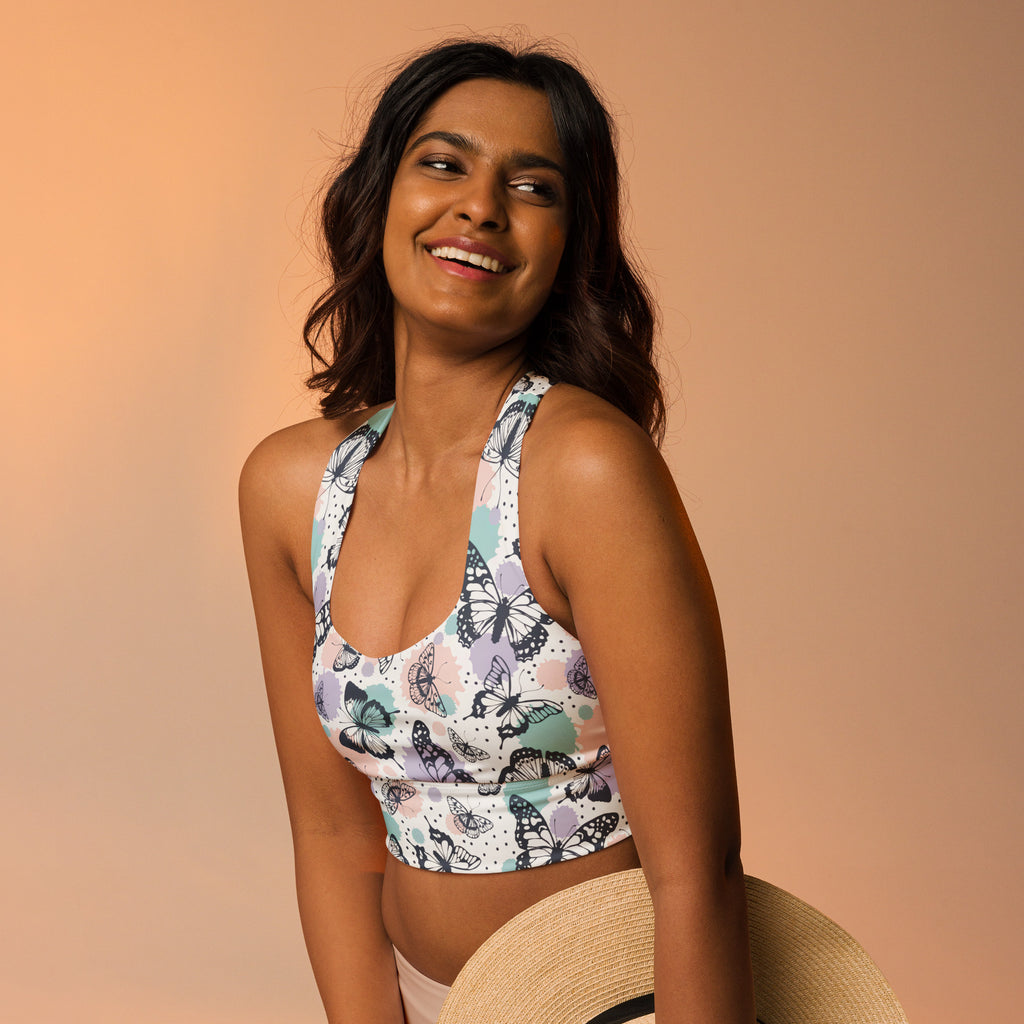 Women’s butterflies buttery soft recycled longline sports bra in white with black teal and lavender butterfly pattern