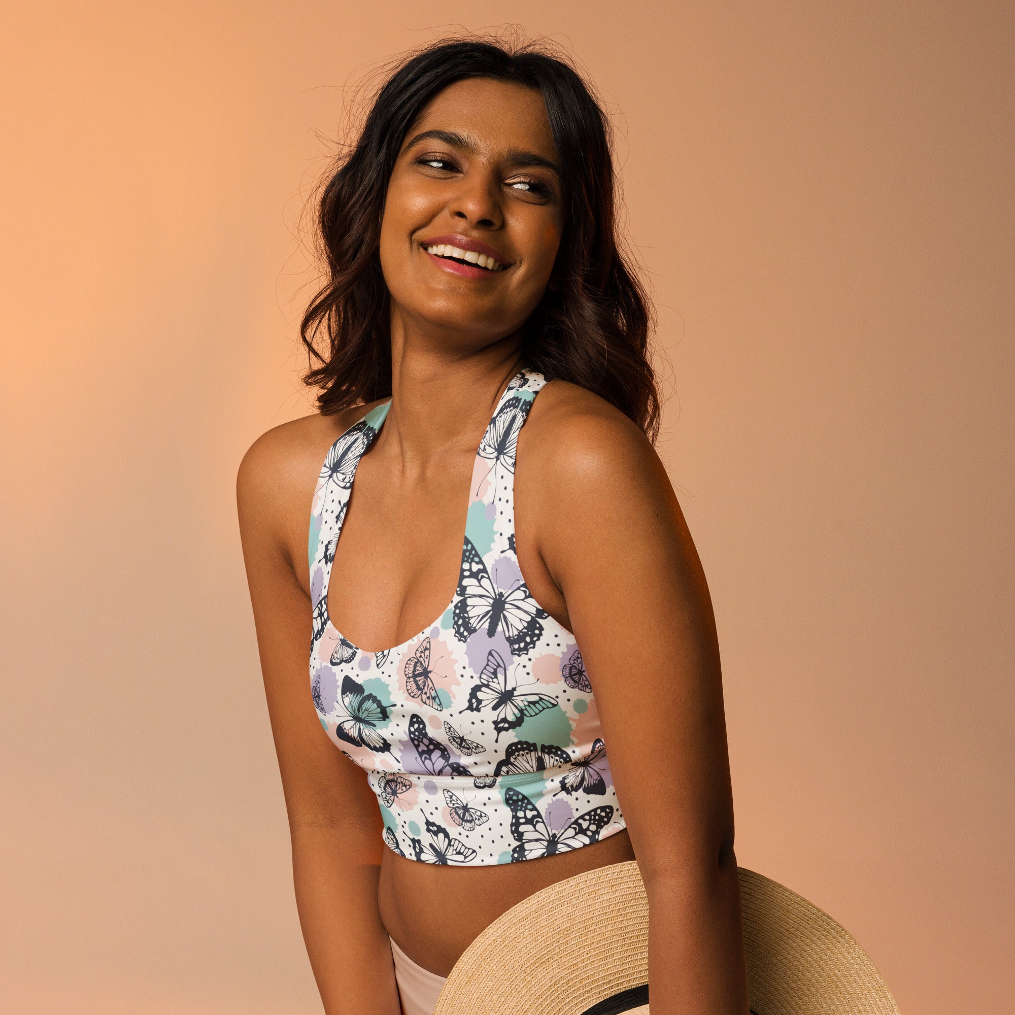 Women’s butterflies buttery soft recycled longline sports bra in white with black teal and lavender butterfly pattern