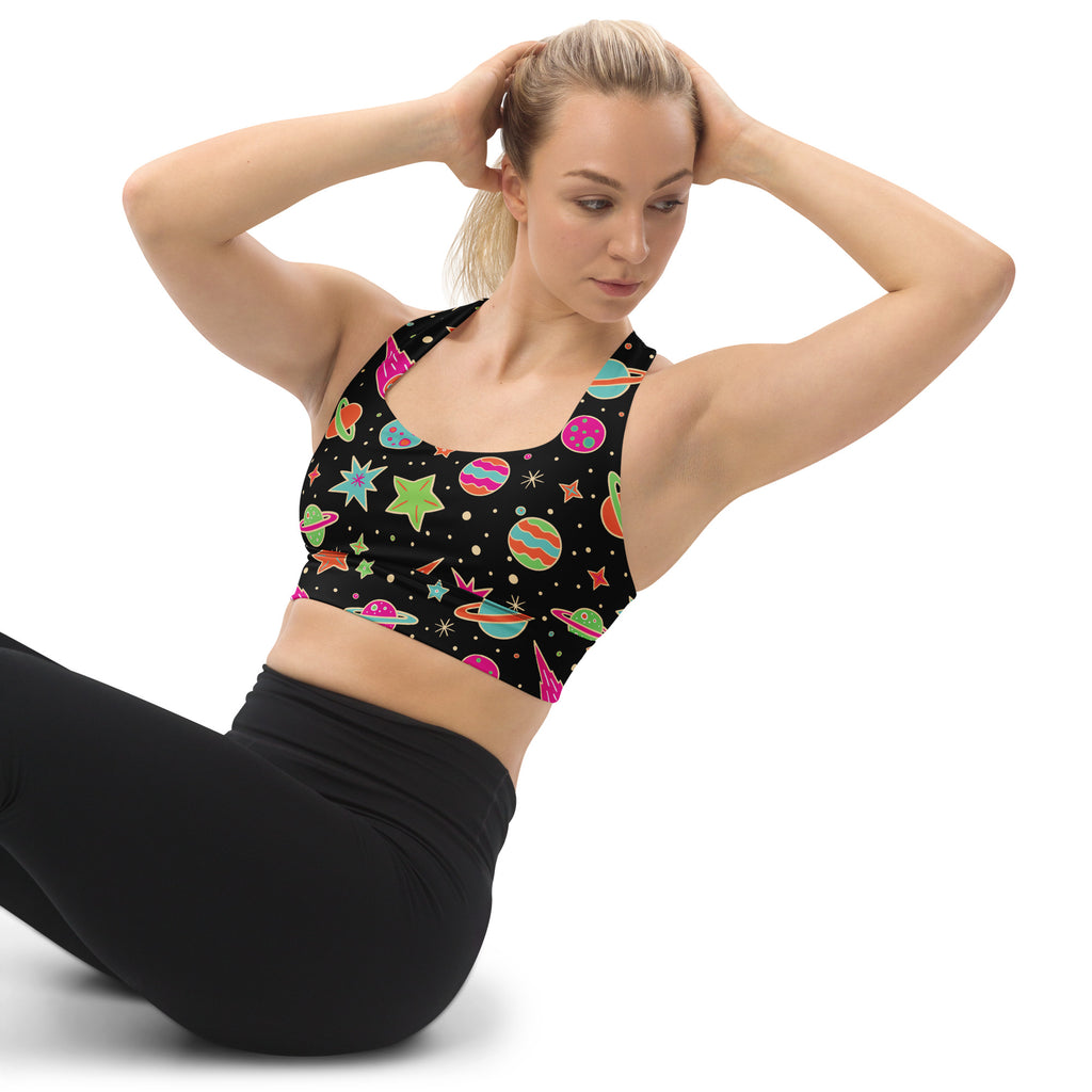 Black womens retro space longline sports bra with vibrant cartoon planets rockets quick dry upf 50 plus support