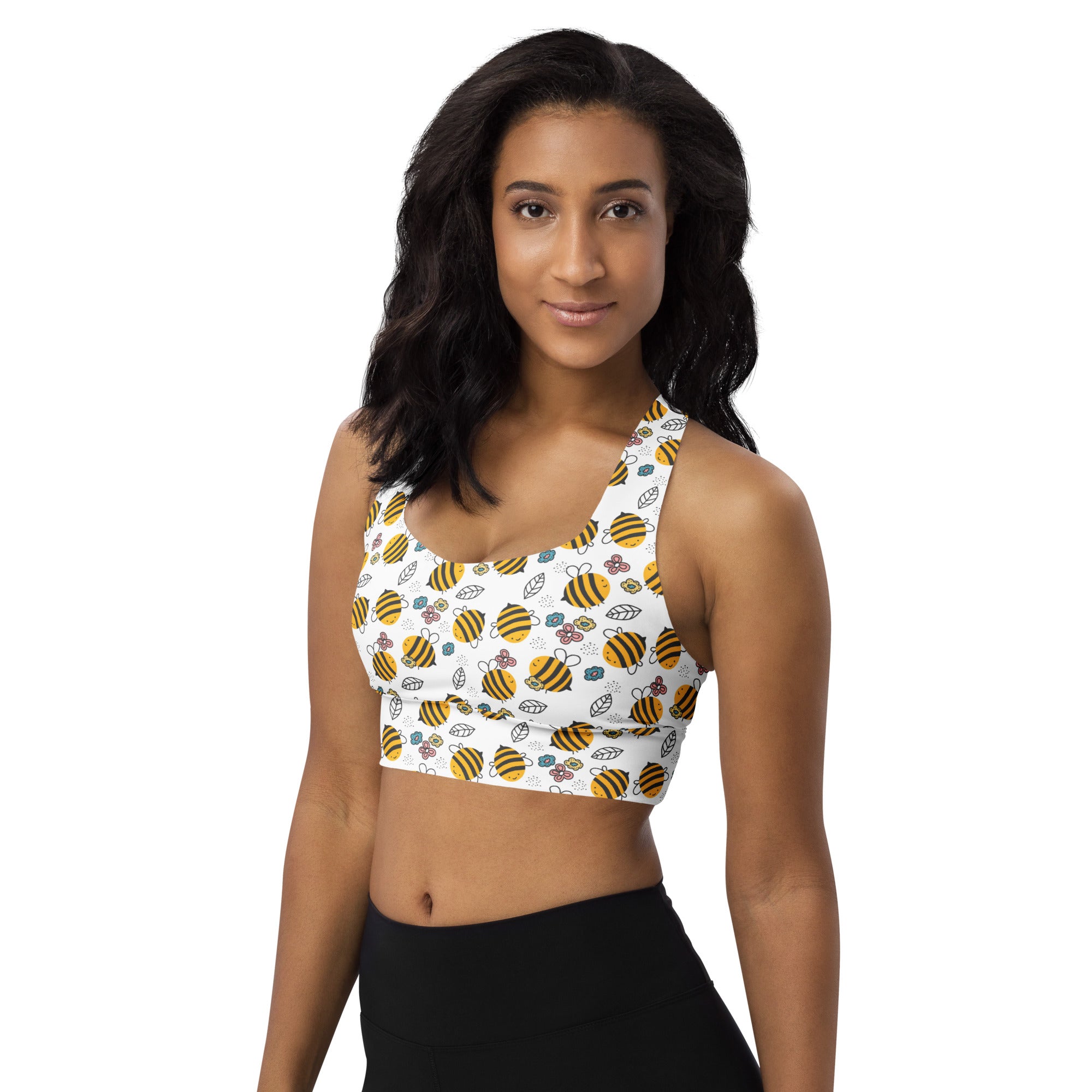 Women’s white recycled longline sports bra with yellow bumblebee floral pattern high intensity support and upf 50+