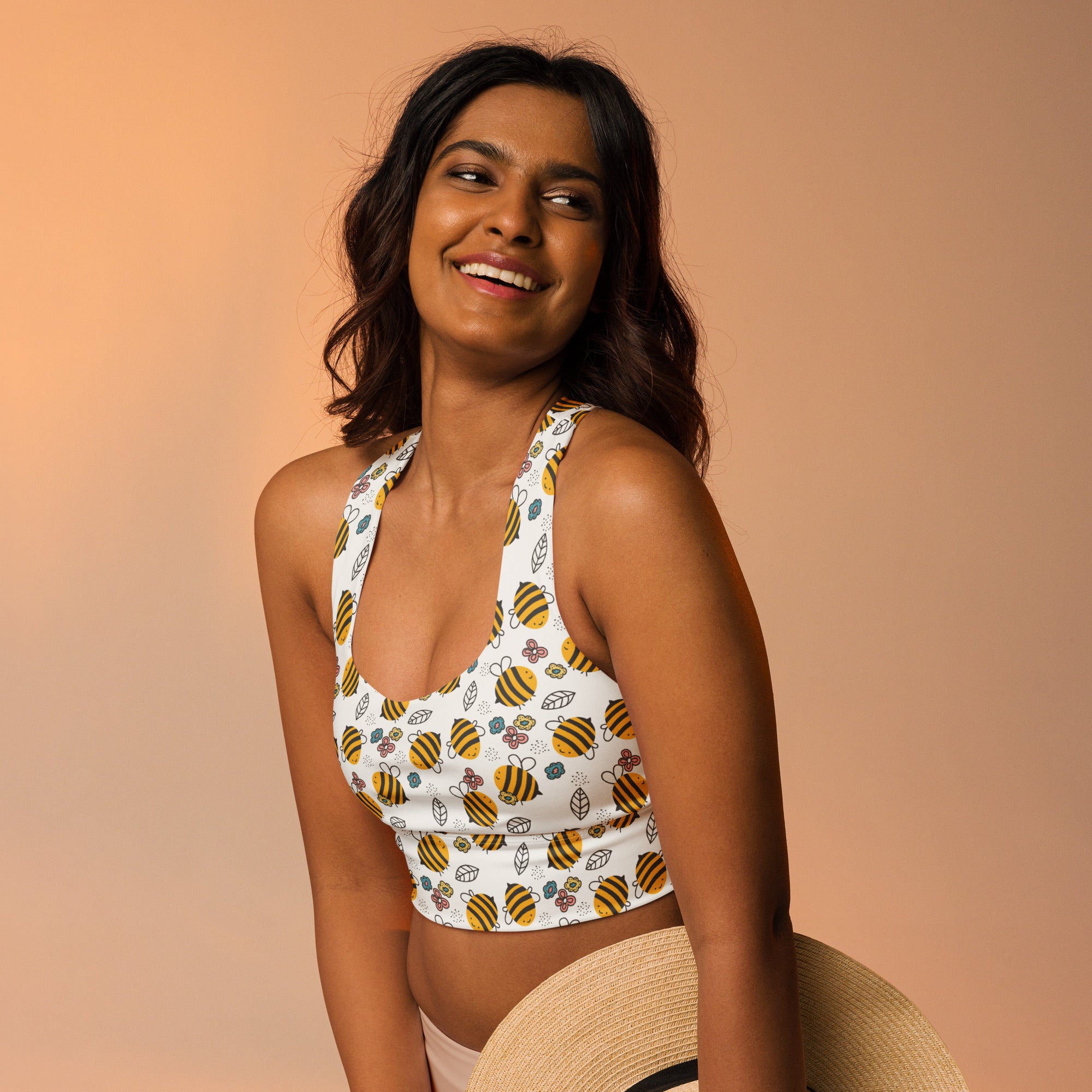 White longline sports bra with yellow and black striped bumblebee patterns buttery soft recycled fabric high support