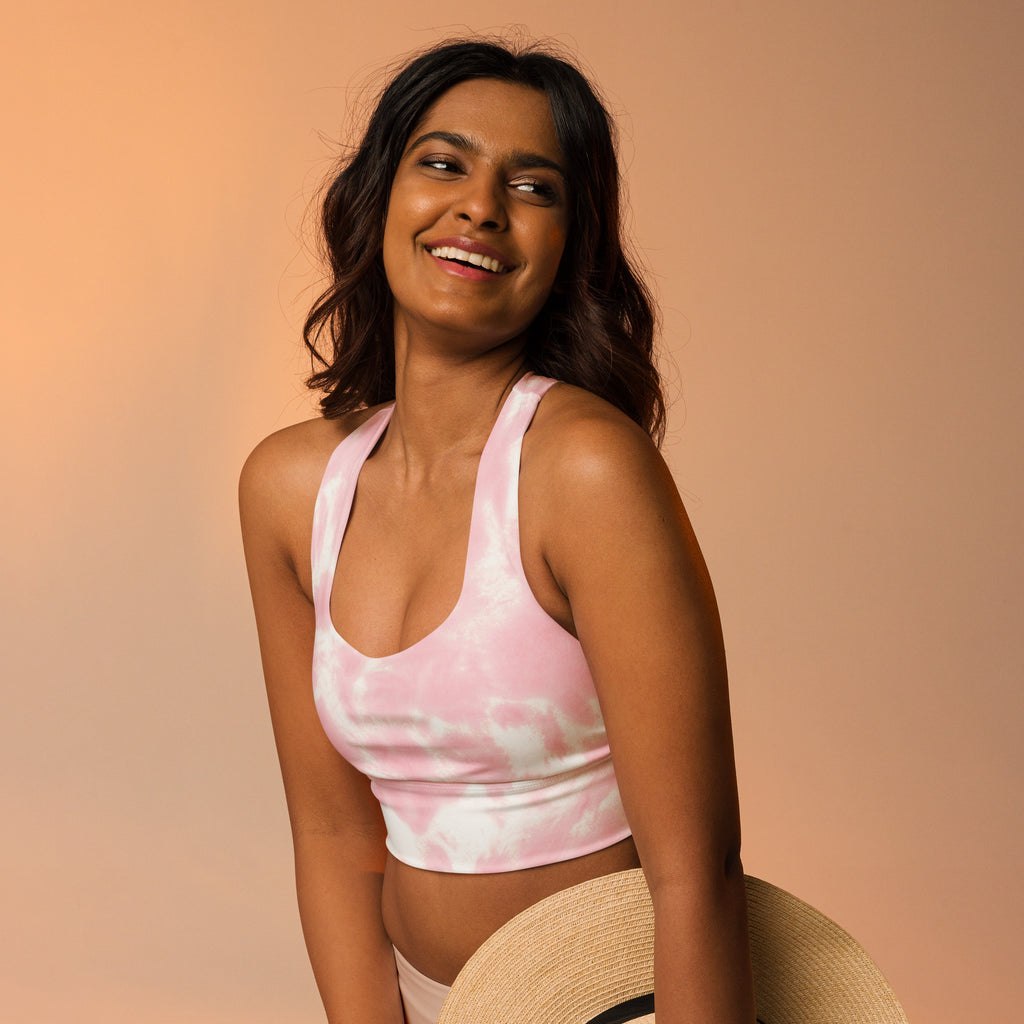 Women’s pink and white tie dye crop top sports bra with high intensity support and quick dry buttery soft recycled fabric