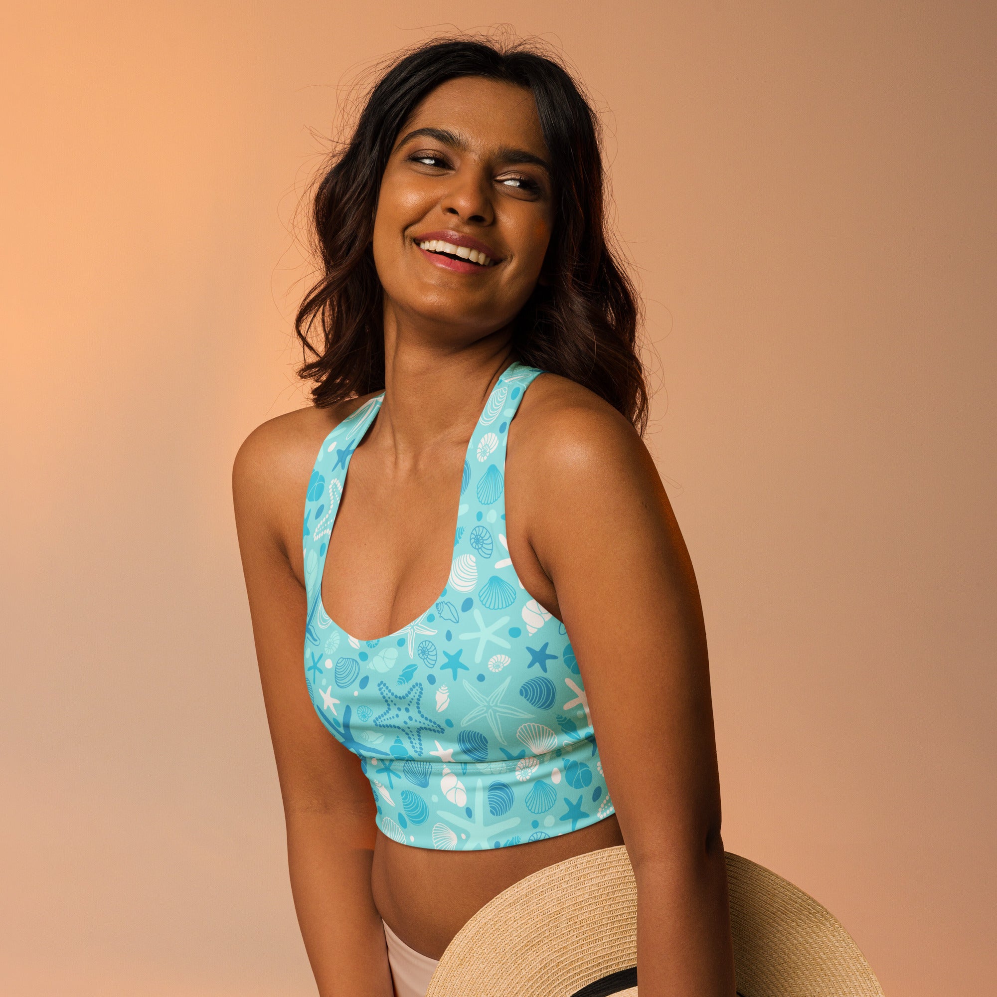 Turquoise womens longline sports bra with white seashell starfish pattern buttery soft recycled fabric high support