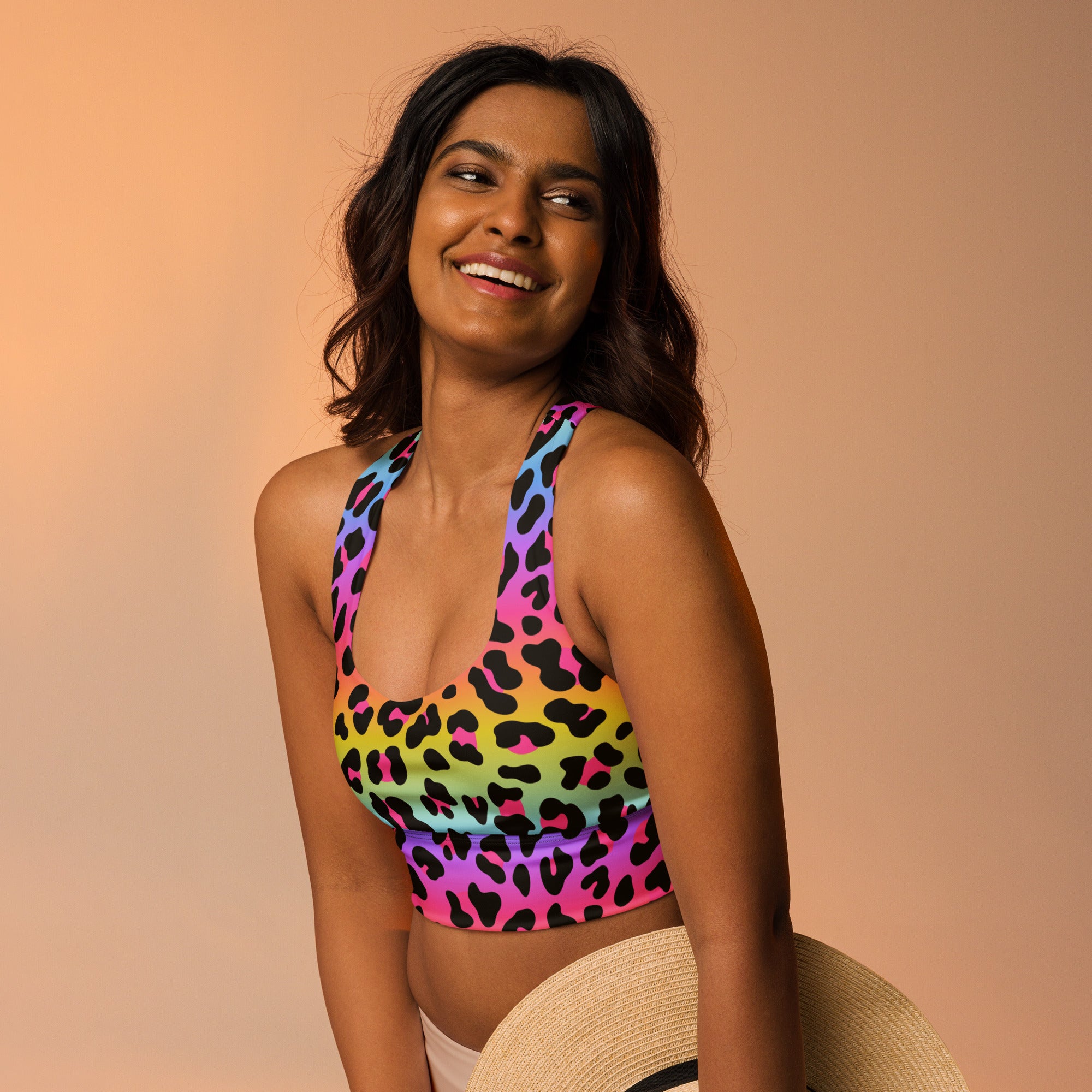 Women’s vibrant rainbow leopard print buttery soft recycled crop top with halter neck straps for high intensity support