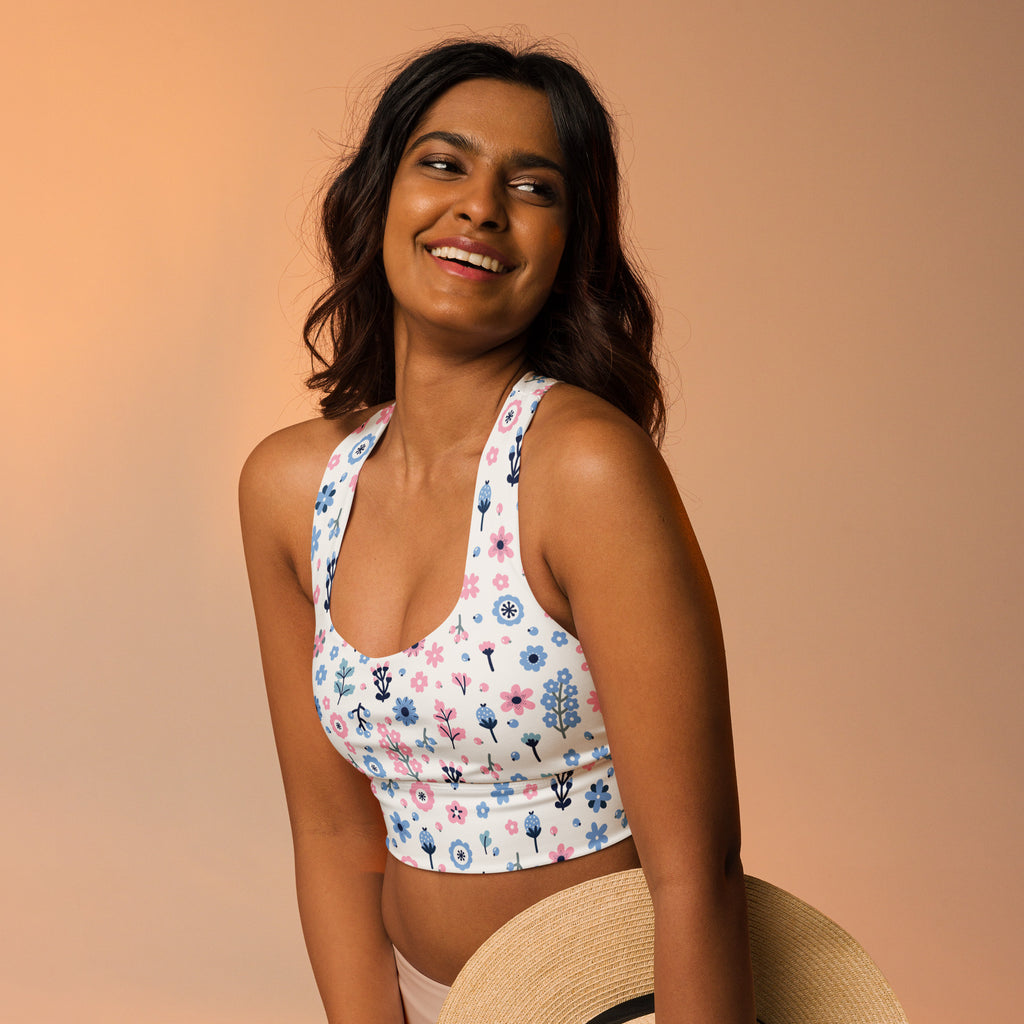 Women’s floral print buttery soft recycled longline sports bra with pink and blue floral pattern and thin halter straps