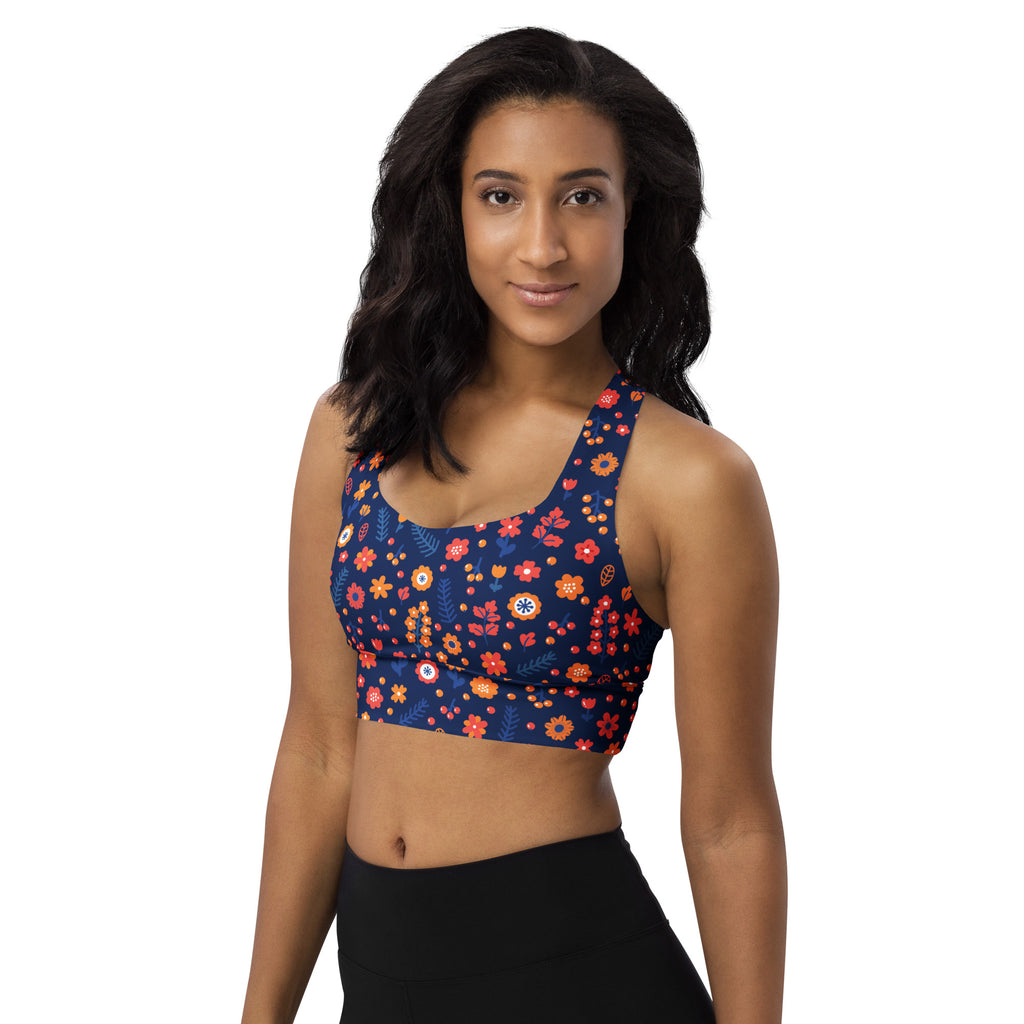 Women’s navy blue longline sports bra with vibrant red orange yellow floral pattern buttery soft recycled fabric high support