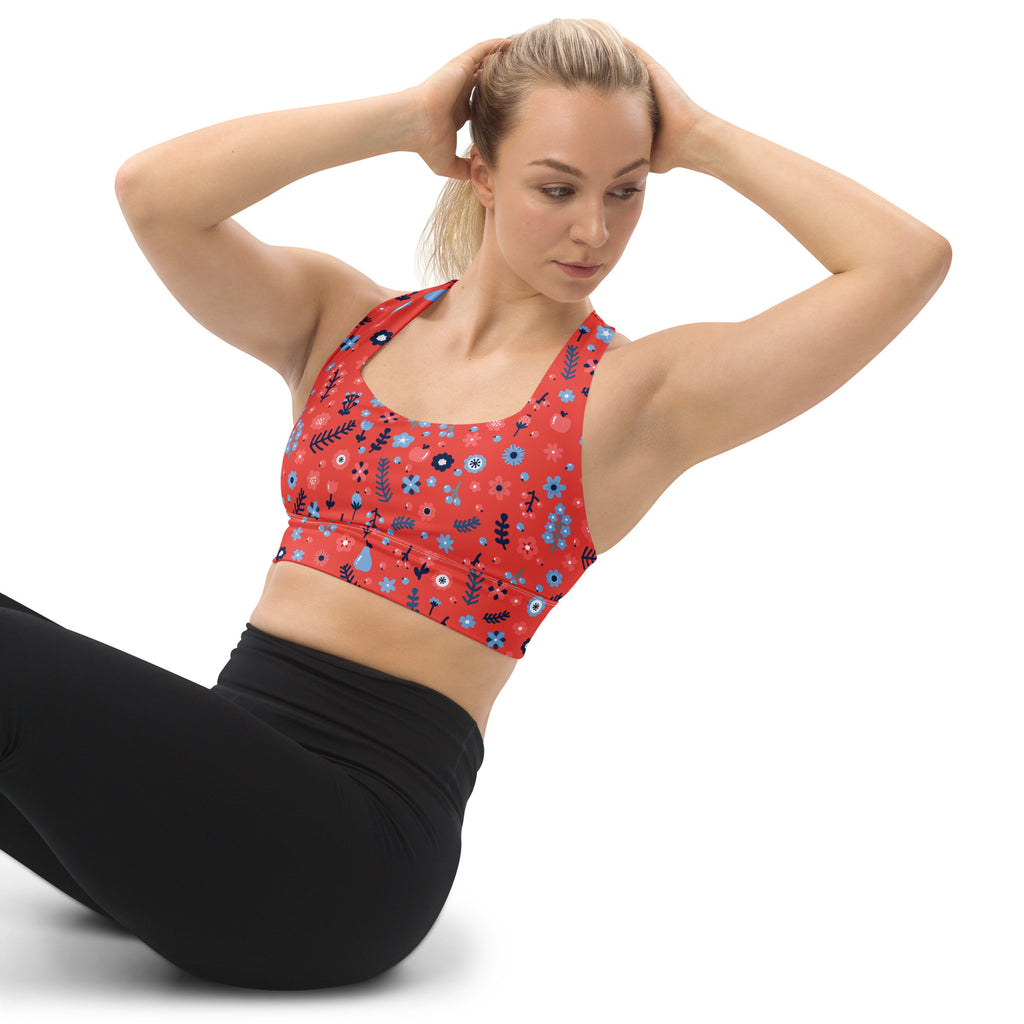 Women’s coral red floral sports bra with blue and black botanical designs buttery soft recycled fabric