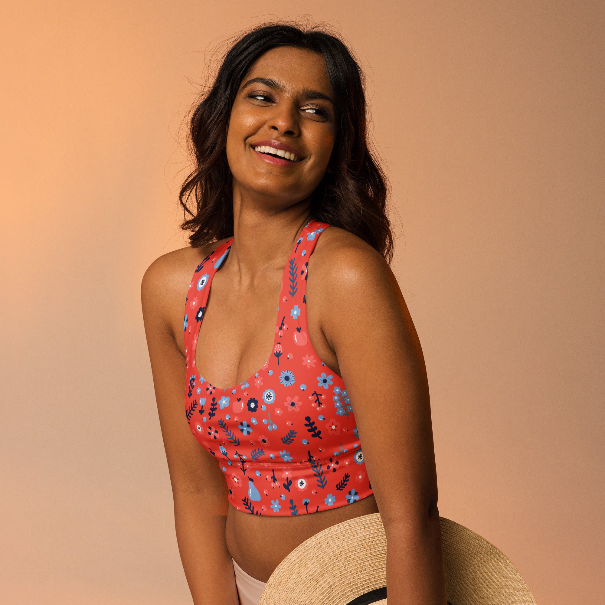 Women’s coral red floral buttery soft recycled longline sports bra with blue and black flowers for high intensity support