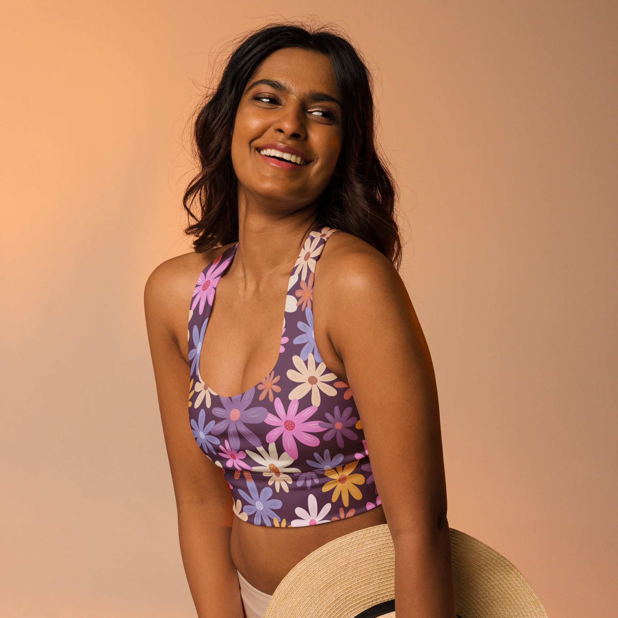Women’s purple floral buttery soft recycled longline sports bra with halter neckline and colorful daisy pattern