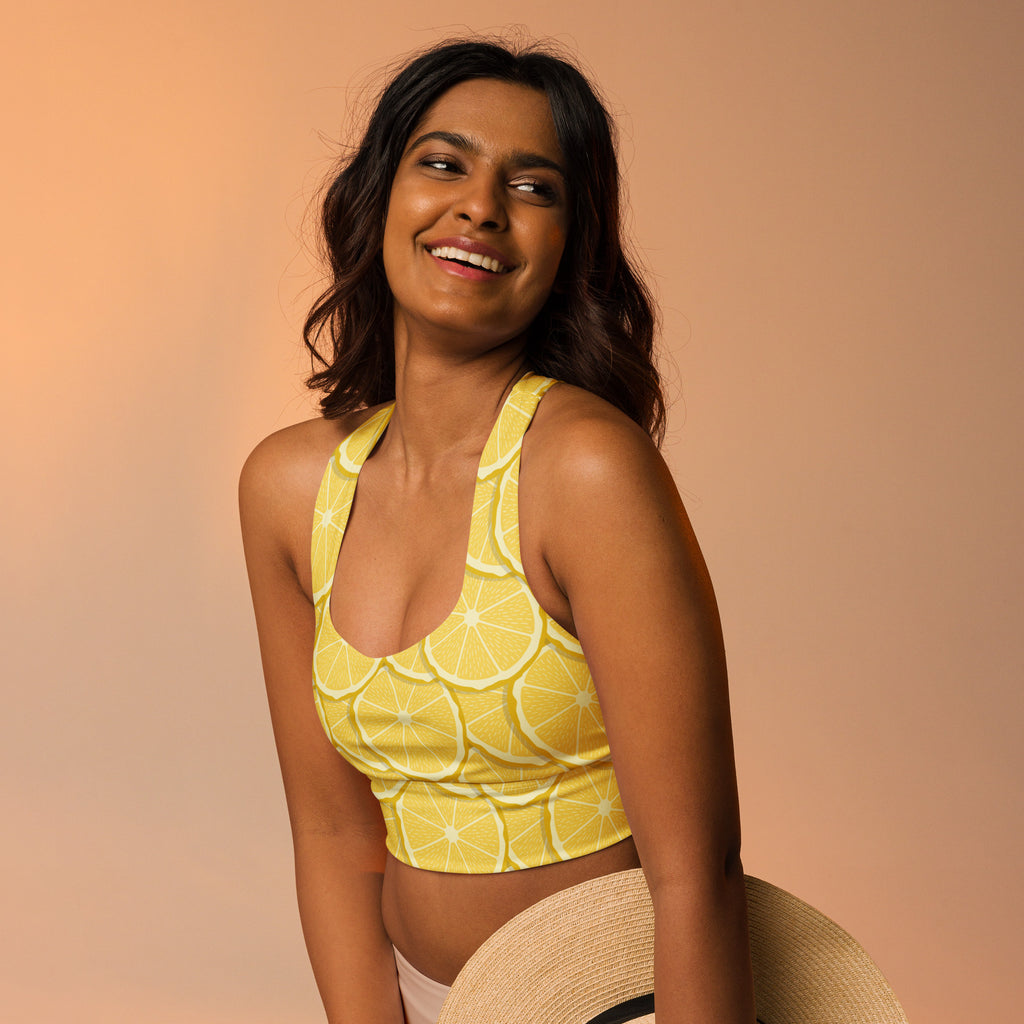 Women’s lemon print buttery soft recycled longline sports bra with yellow lemon slice design for high intensity support