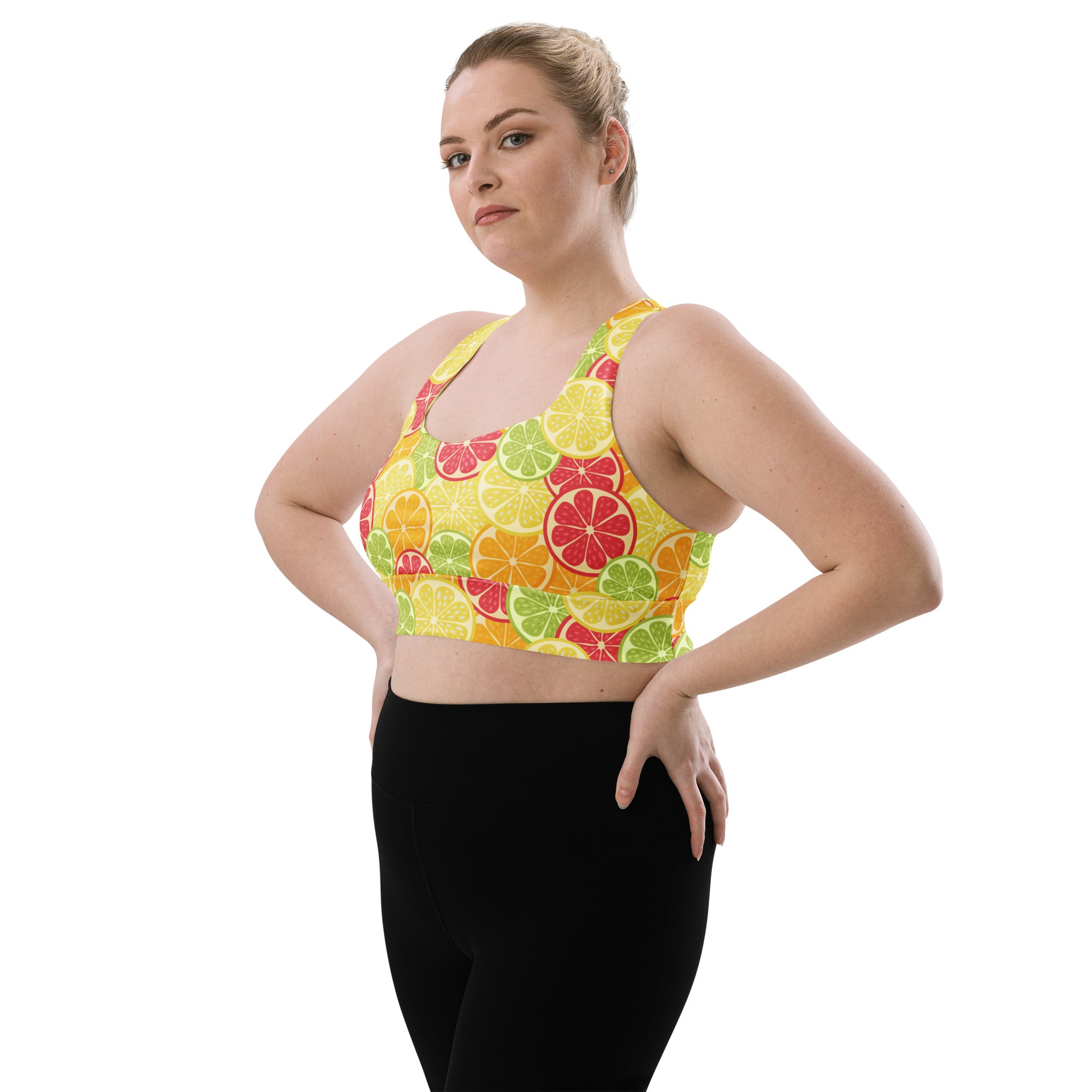 A vibrant yellow women’s citrus slice buttery soft recycled longline sports bra with high intensity support and removable padding