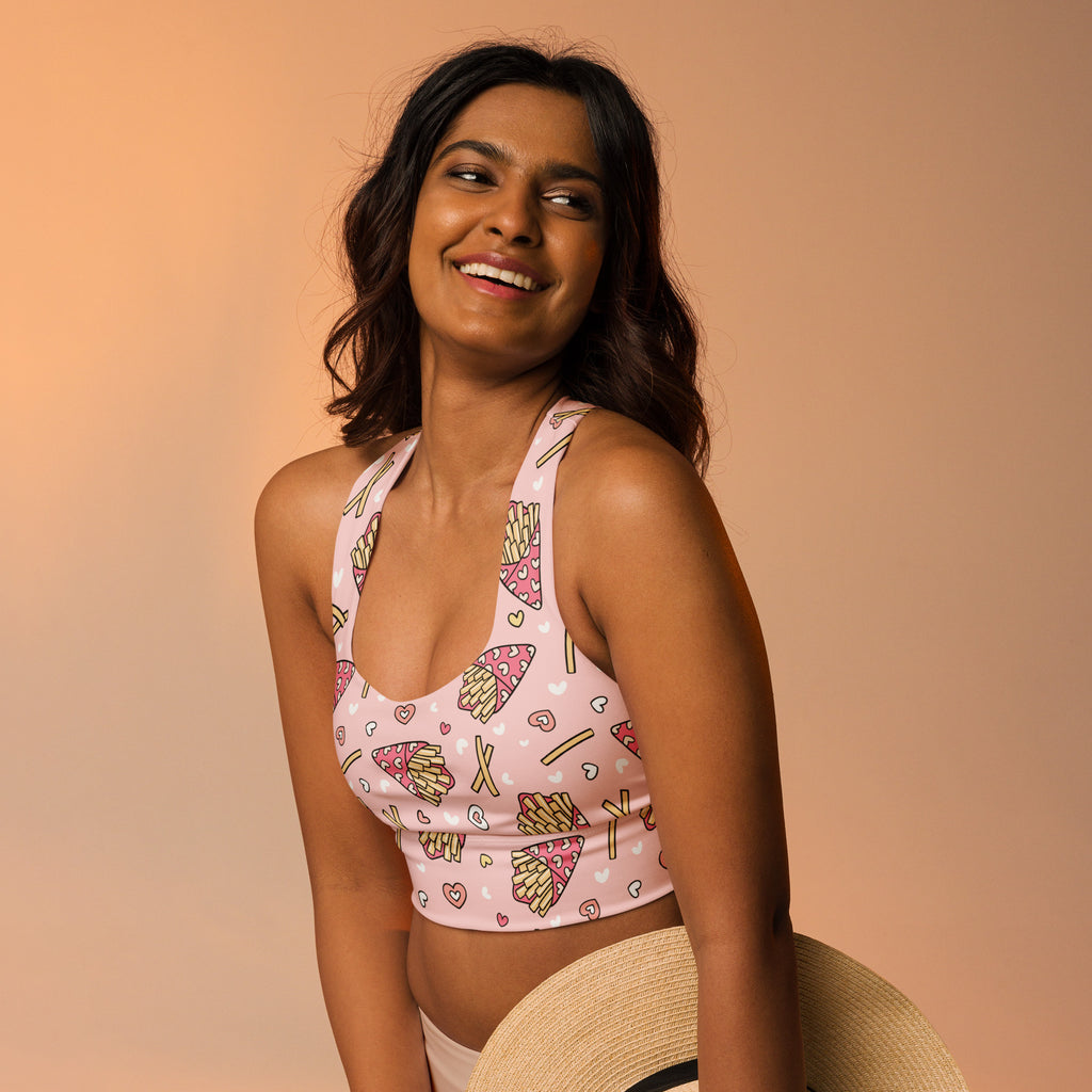 Women’s pink buttery soft recycled longline sports bra with playful pizza fries and hearts pattern for high intensity support
