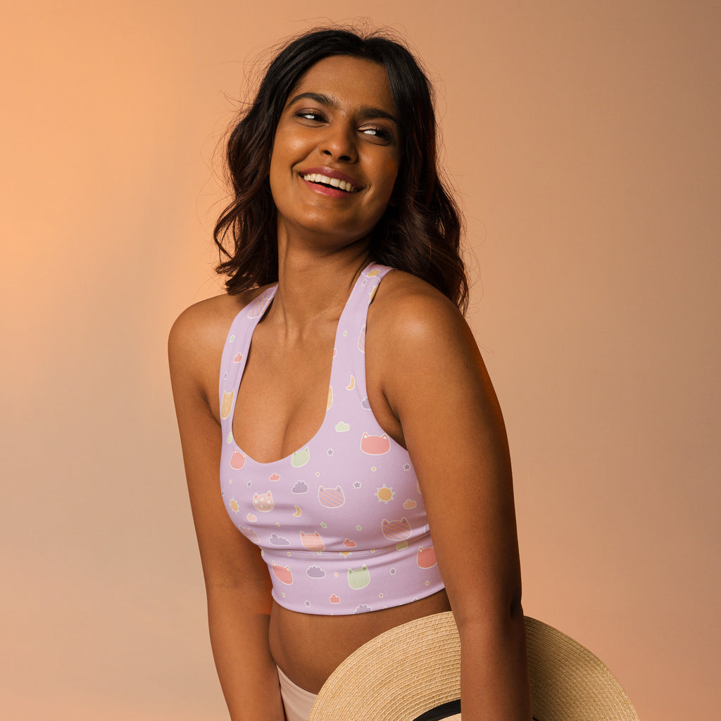 Lavender longline sports bra with pastel kawaii cat faces and clouds made of buttery soft recycled fabric for high support