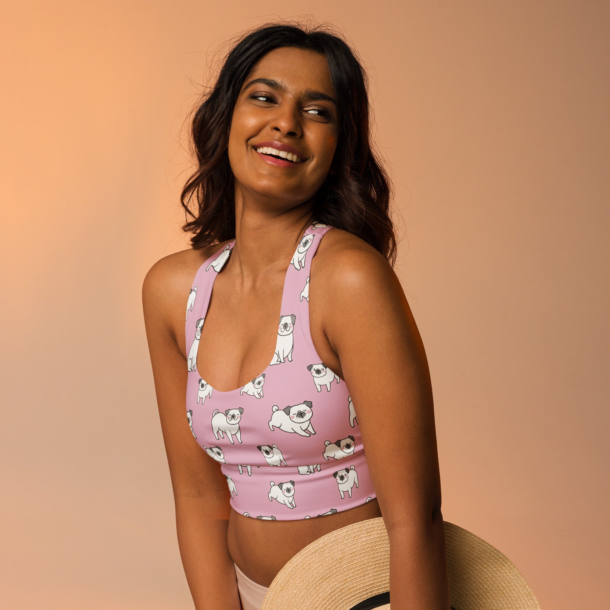 Women’s pink pug buttery soft recycled longline sports bra with white pug pattern high intensity support and quick dry