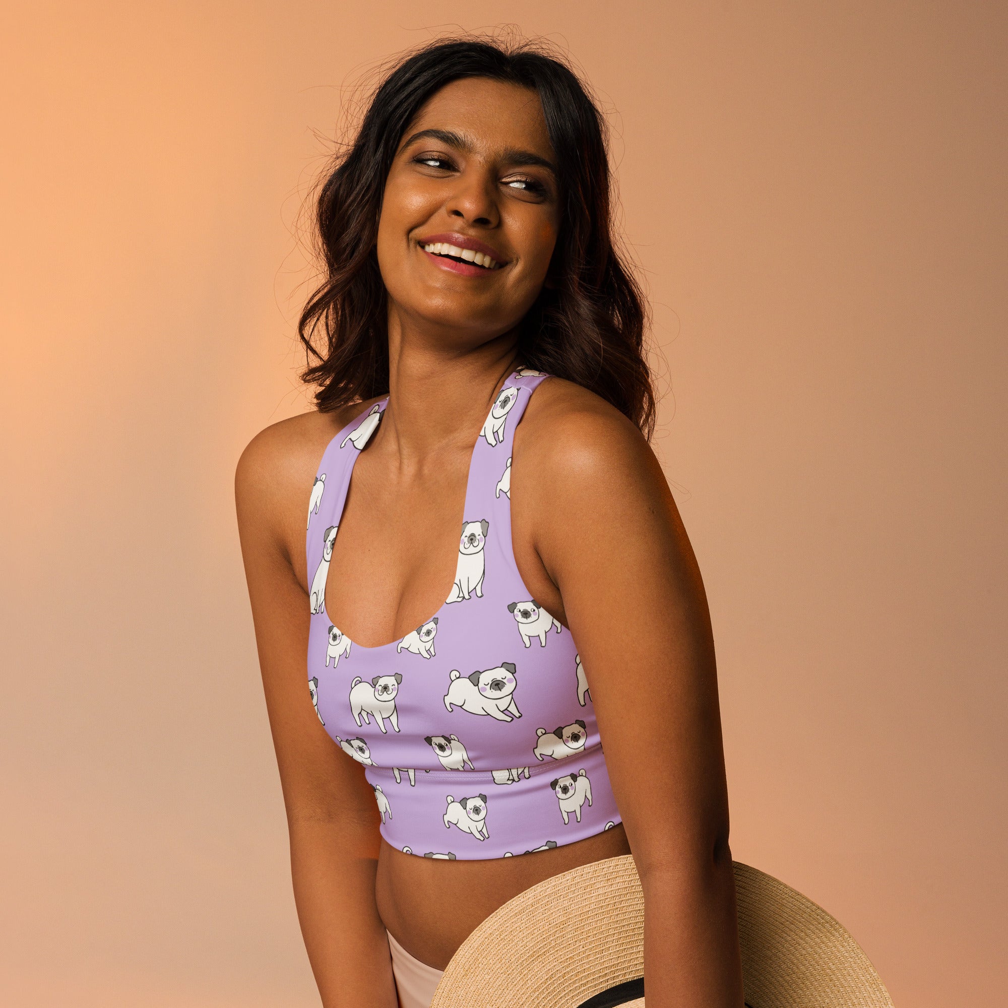 Women’s purple longline sports bra with white pug illustrations buttery soft recycled fabric high intensity support