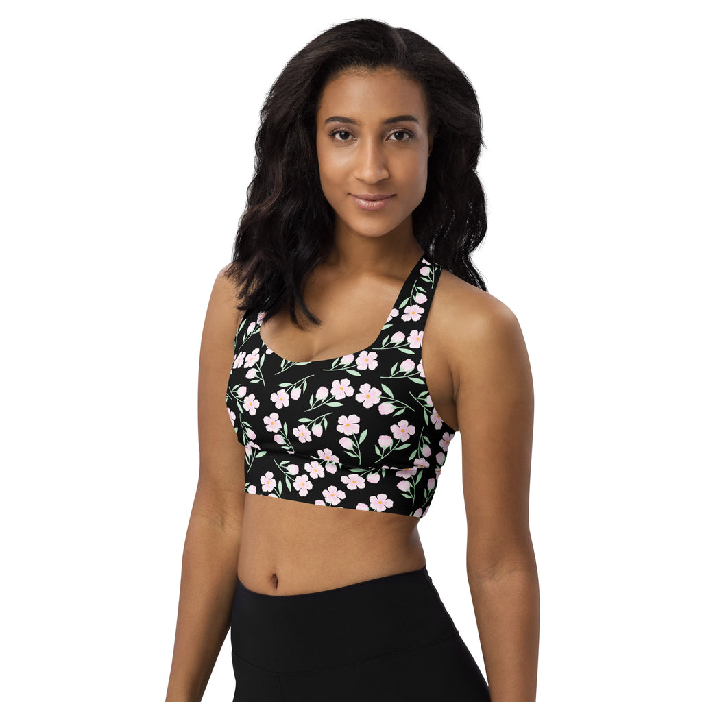 Women’s black floral print buttery soft recycled longline sports bra with delicate pink pattern and thin straps
