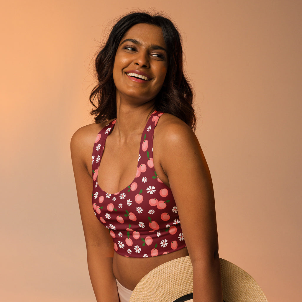 Women’s maroon buttery soft recycled longline sports bra with pink peaches white daisies for high intensity support