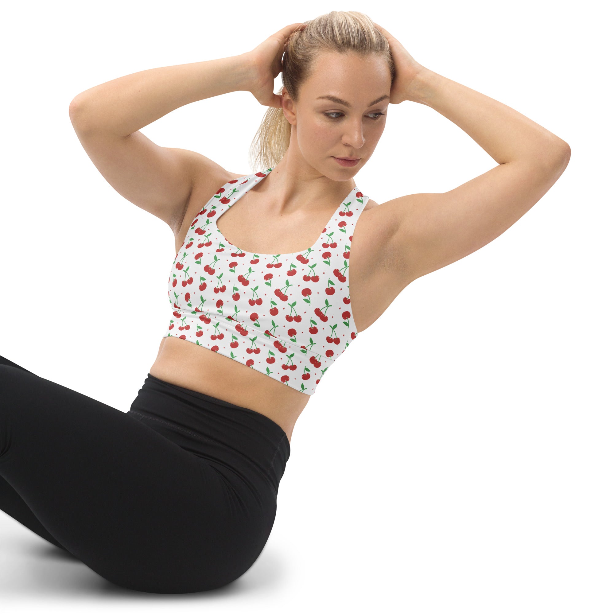 White longline sports bra with red cherry and green stem pattern buttery soft recycled fabric high intensity support